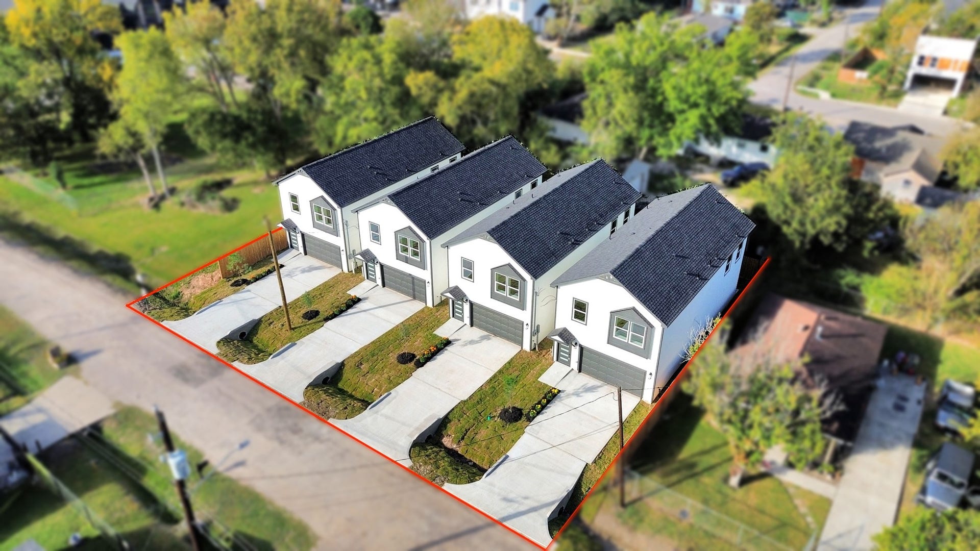 6673 Nielan Street, Houston, TX 77028 Additional aerial view highlighting the four neighboring new construction homes, their matching architectural styles, individual lots, fenced yards & surrounding properties.