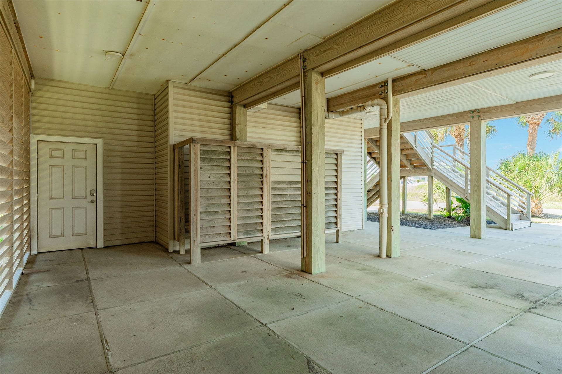 20911 W Sand Hill Drive, Galveston, TX 77554 Outdoor shower is perfect for rinsing off after a day at the Beach. Slats on the wall to the left can be removed for beach views