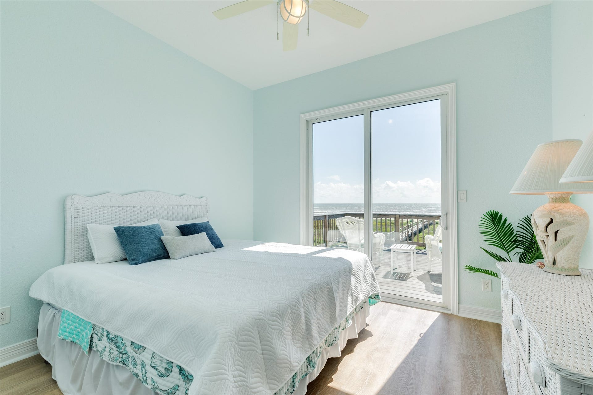 20911 W Sand Hill Drive, Galveston, TX 77554 Bedroom 2 on the main level has deck access. Both of the bedrooms are off a private hallway