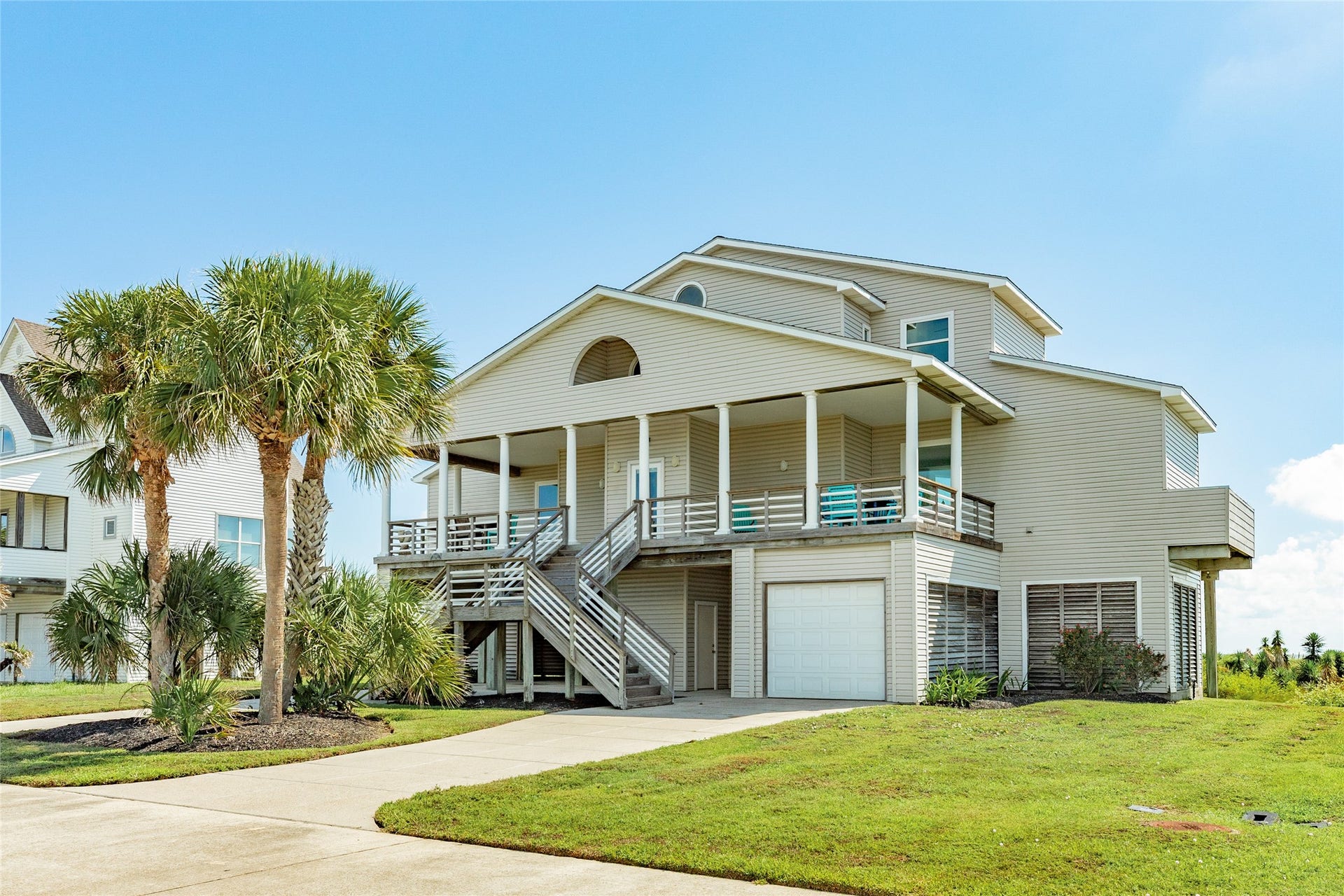 20911 W Sand Hill Drive, Galveston, TX 77554 Two driveways provide plenty of parking for family and friends