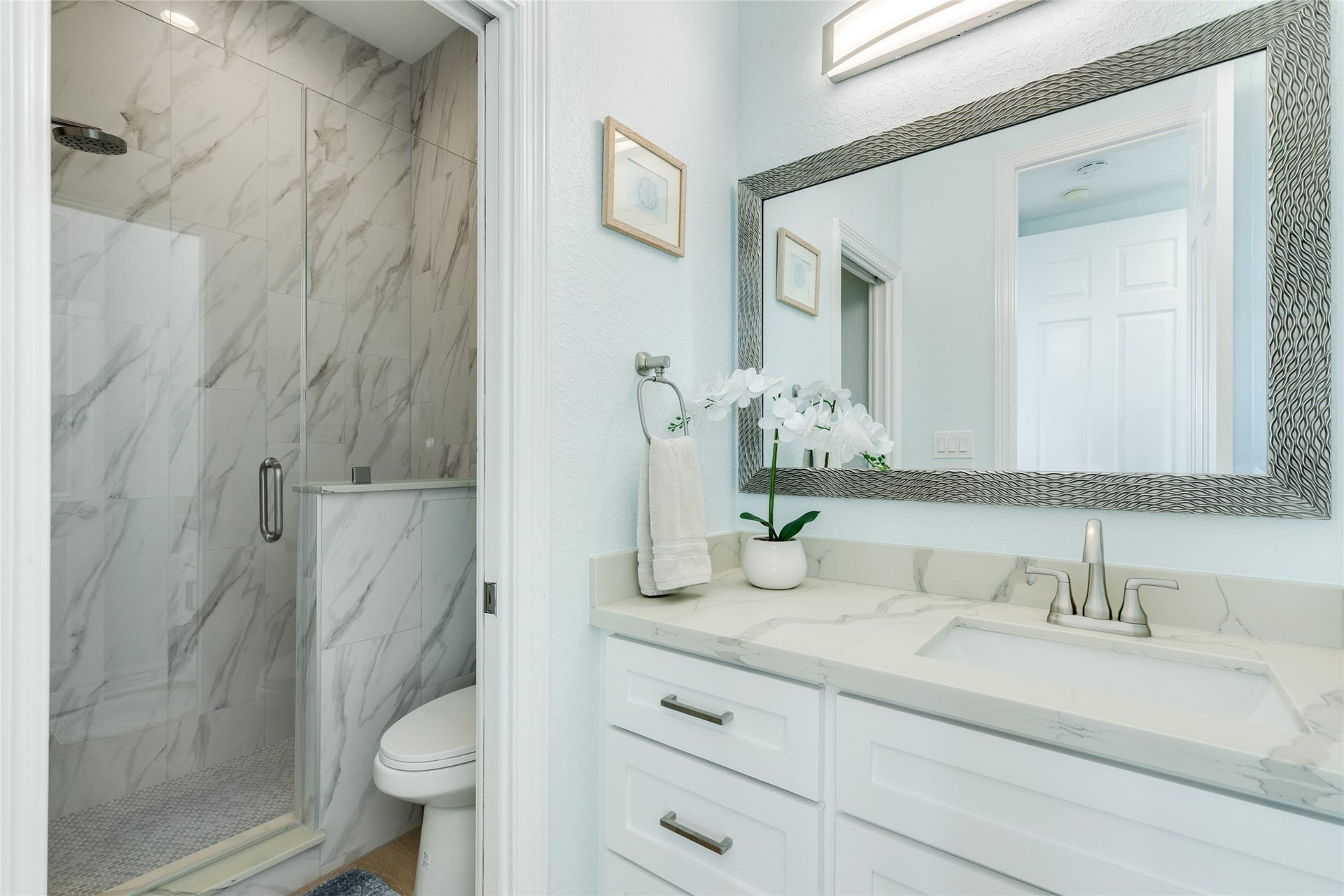 20911 W Sand Hill Drive, Galveston, TX 77554 Remodeled full bathroom on the main level has a walk-in shower