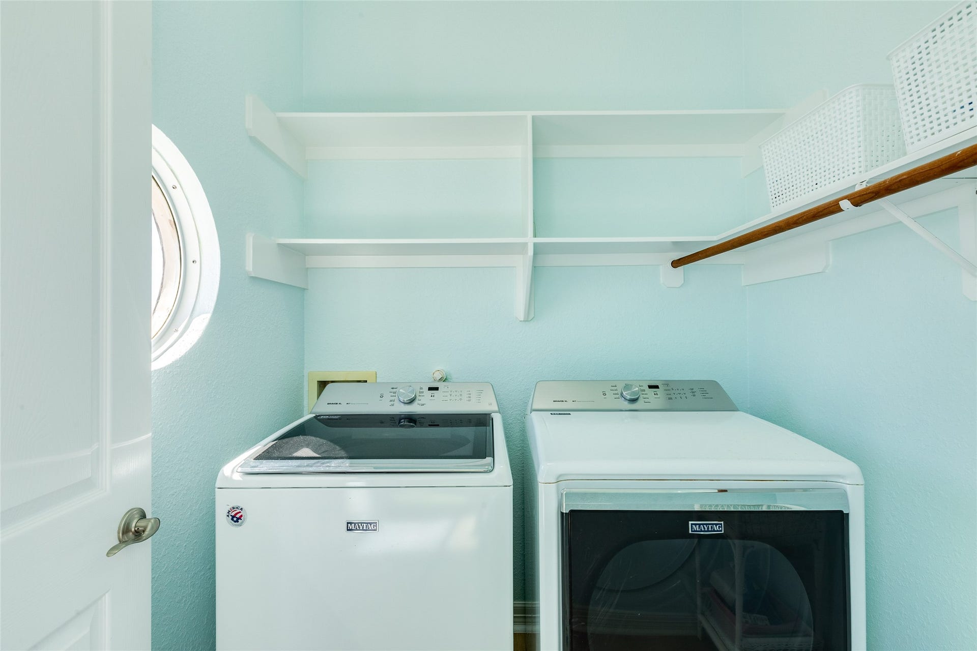 20911 W Sand Hill Drive, Galveston, TX 77554 Utility room off the kitchen has built-in cabinets and shelves