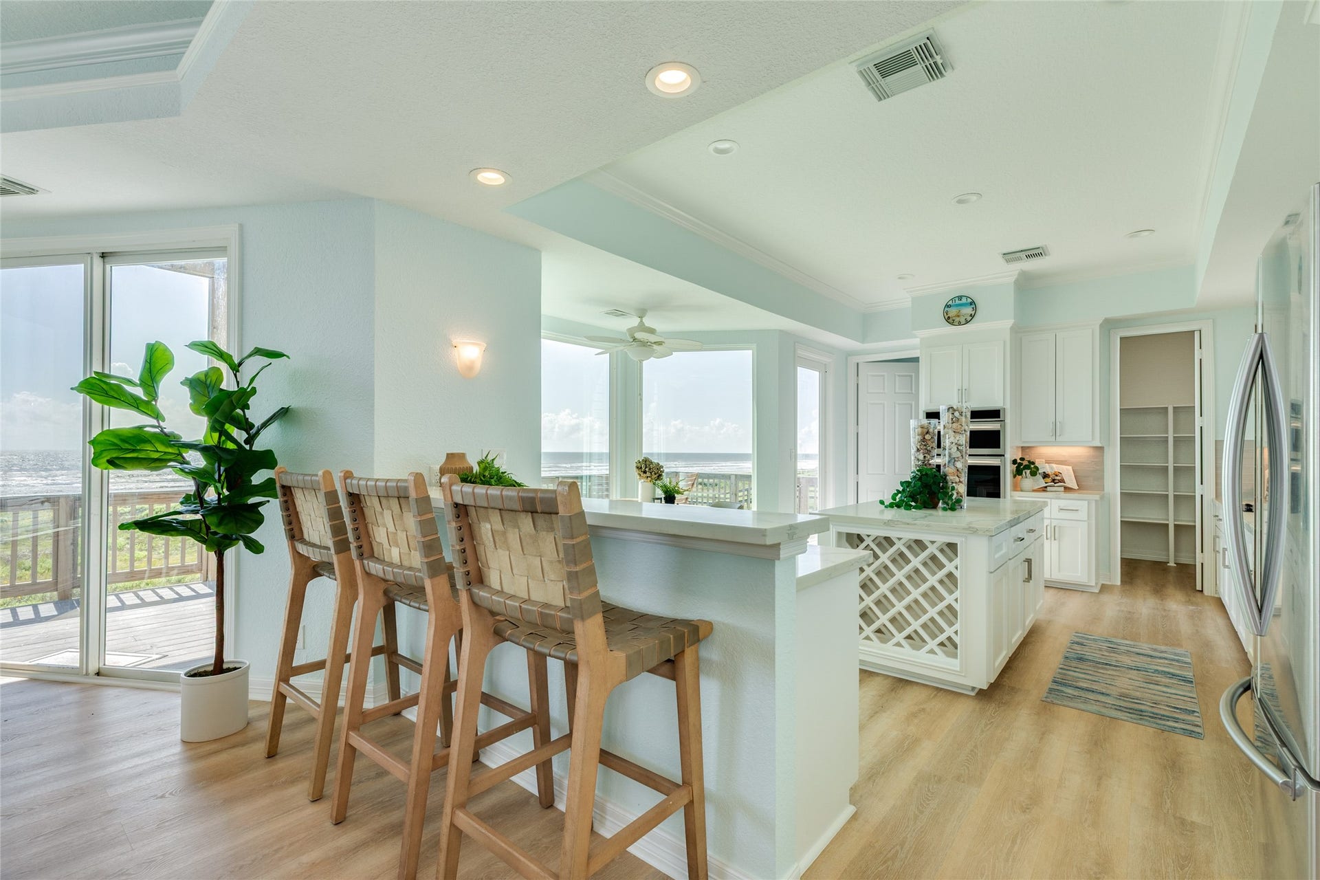 20911 W Sand Hill Drive, Galveston, TX 77554 Updated kitchen features a breakfast bar and built-in wine rack