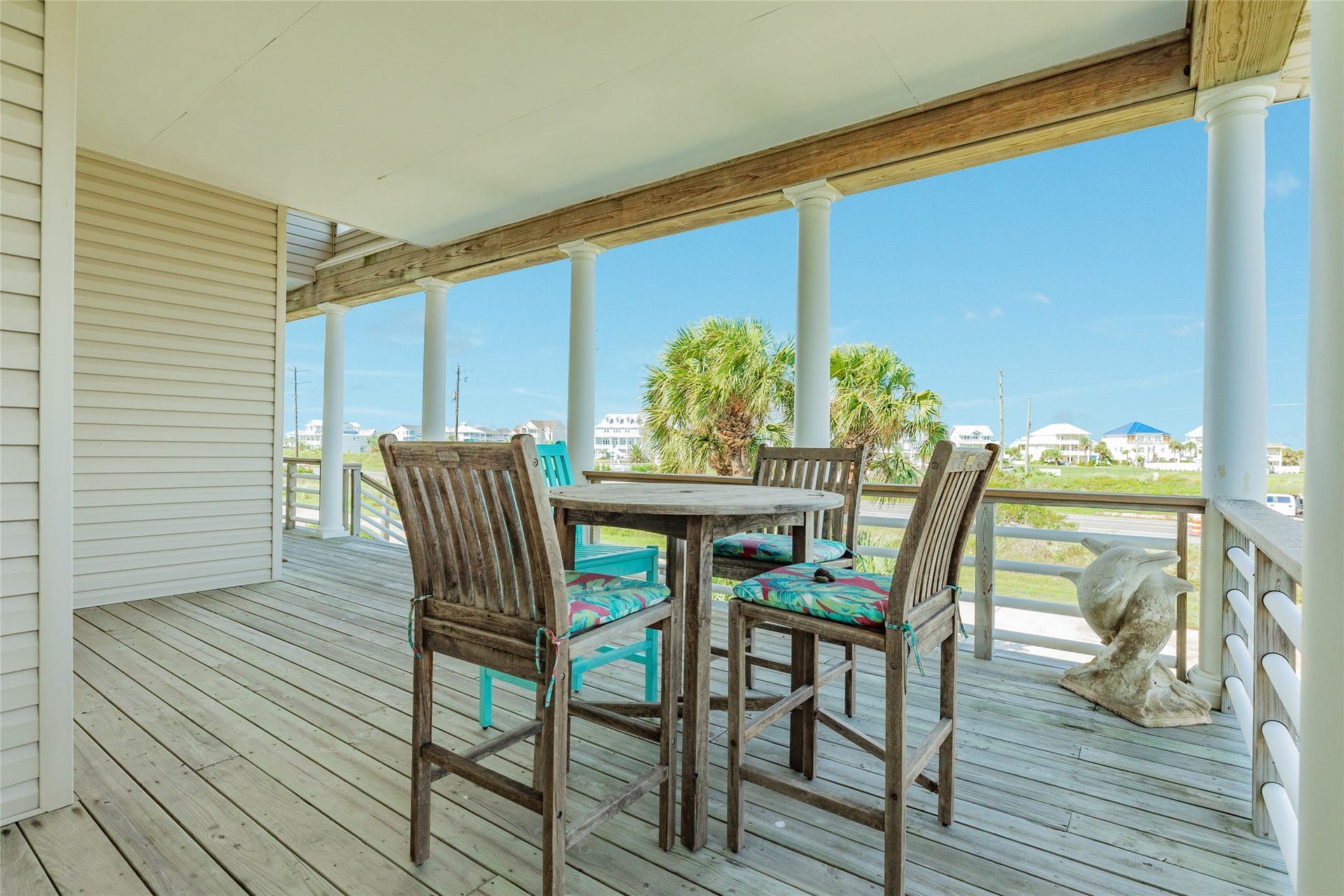 20911 W Sand Hill Drive, Galveston, TX 77554 Covered front porch is perfect for watching Galveston's famous sunsets
