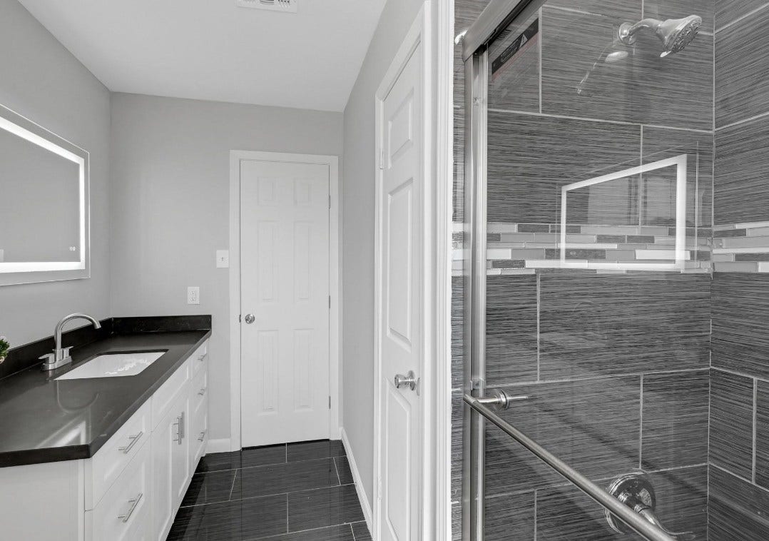 Bathroom with standing shower, recent and modern material