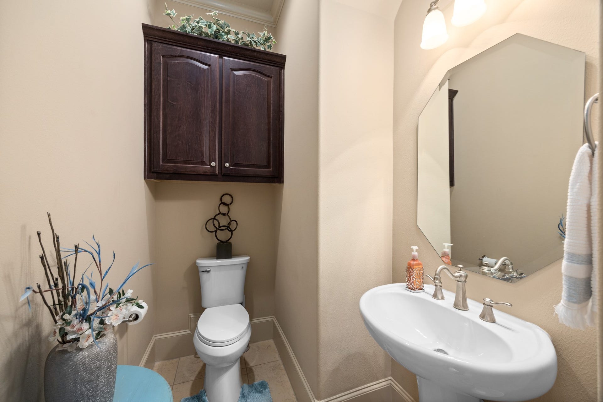4315 Serenade Terrace Drive, Missouri City, TX 77459 Half bathroom is situated downstairs right next to the stairway.