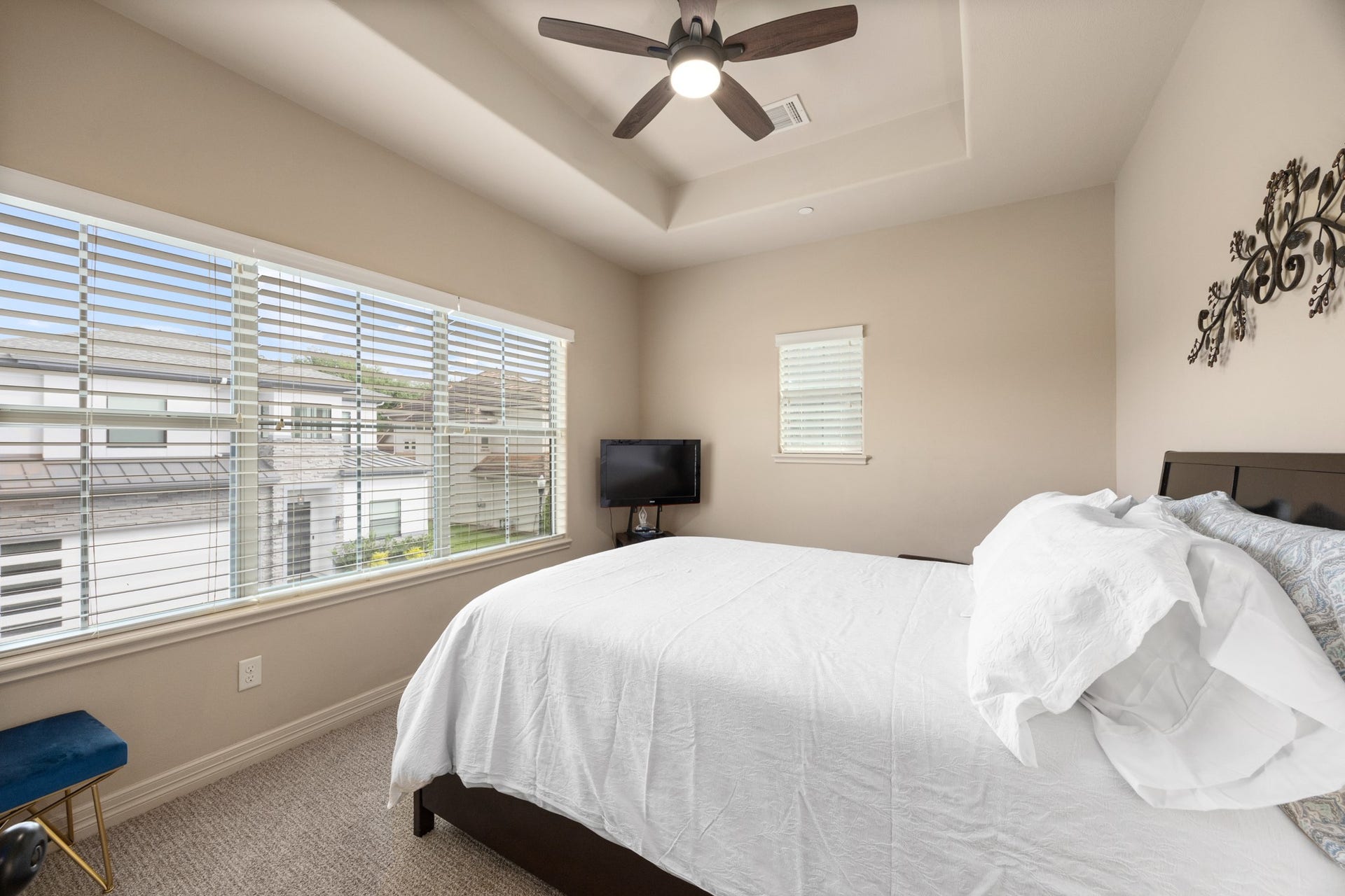 4315 Serenade Terrace Drive, Missouri City, TX 77459 This bedroom features a cozy space with a large window allowing plenty of natural light, a ceiling fan, and neutral tones.