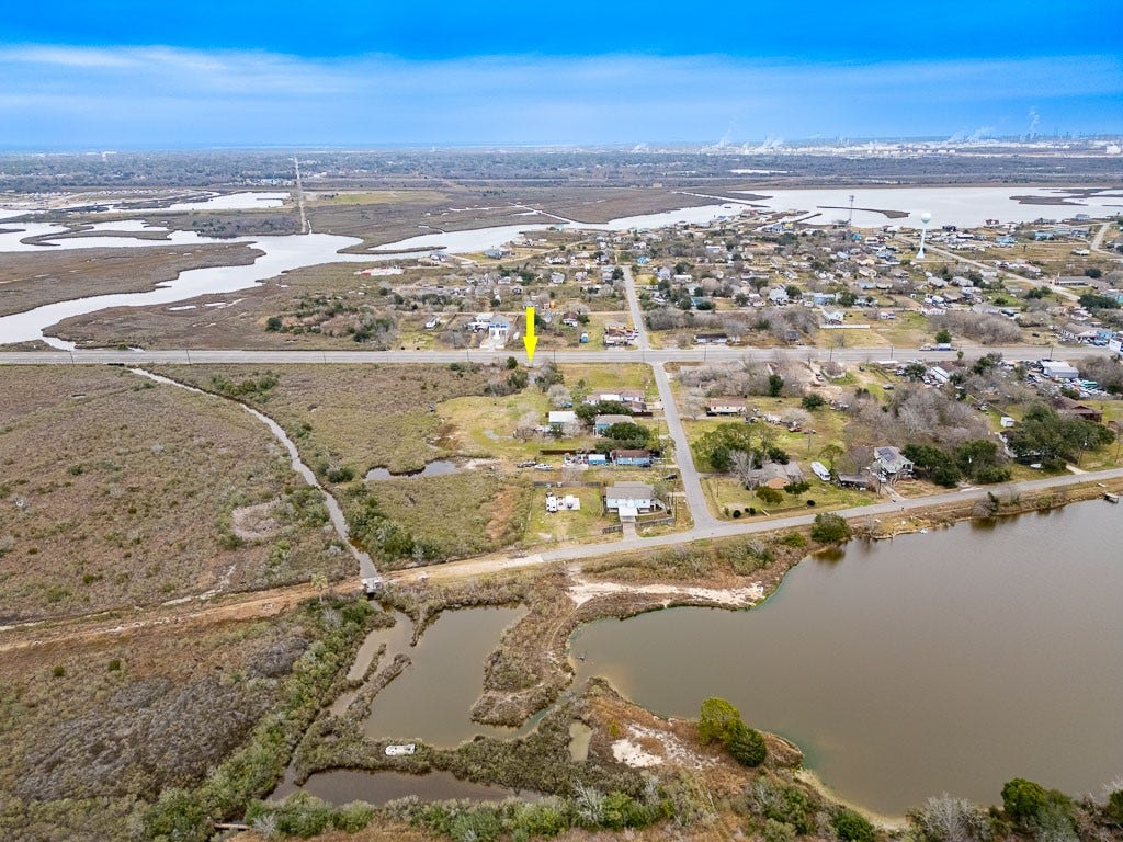 4811 Highway 6, Hitchcock, TX 77563 Aerial view from across the nearby waterway with arrow identifying the subject property's Highway 6 location.