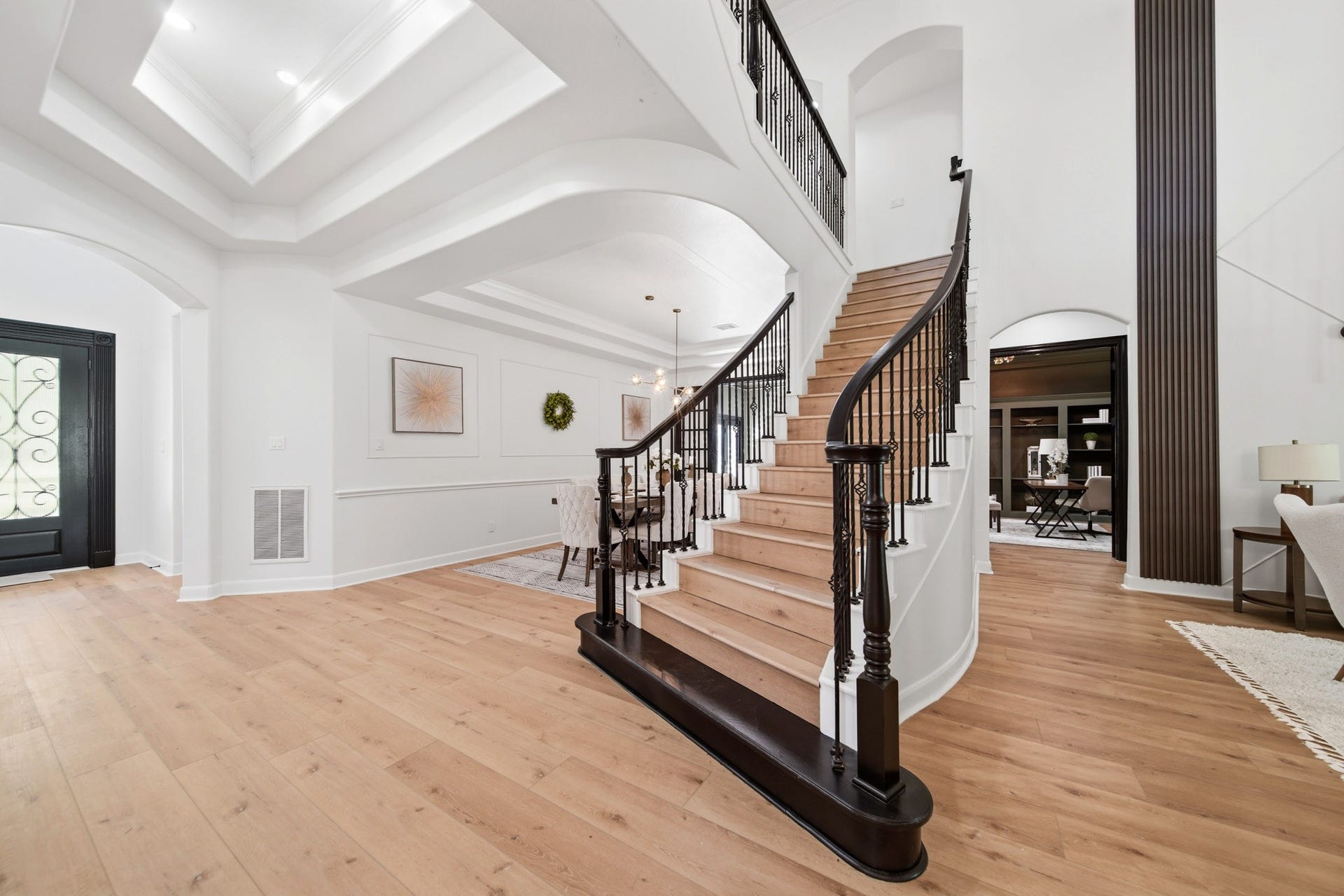 15 Bees Creek Court, Missouri City, TX 77459 Grand entry with soaring ceilings, elegant staircase, and designer finishes throughout.