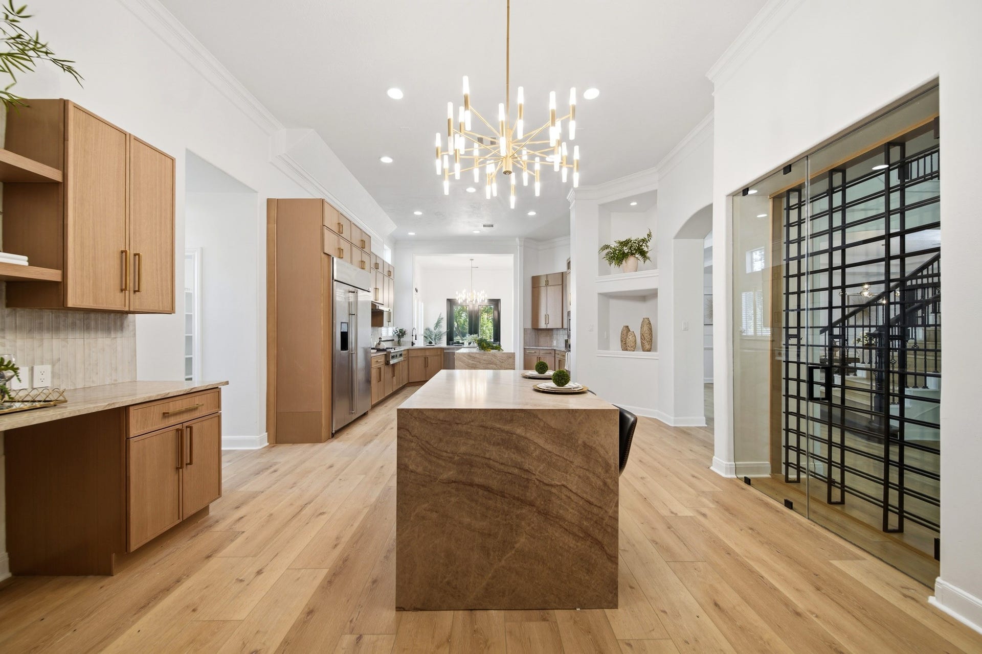15 Bees Creek Court, Missouri City, TX 77459 Gourmet kitchen featuring high-end appliances, abundant prep space, and elegant design.