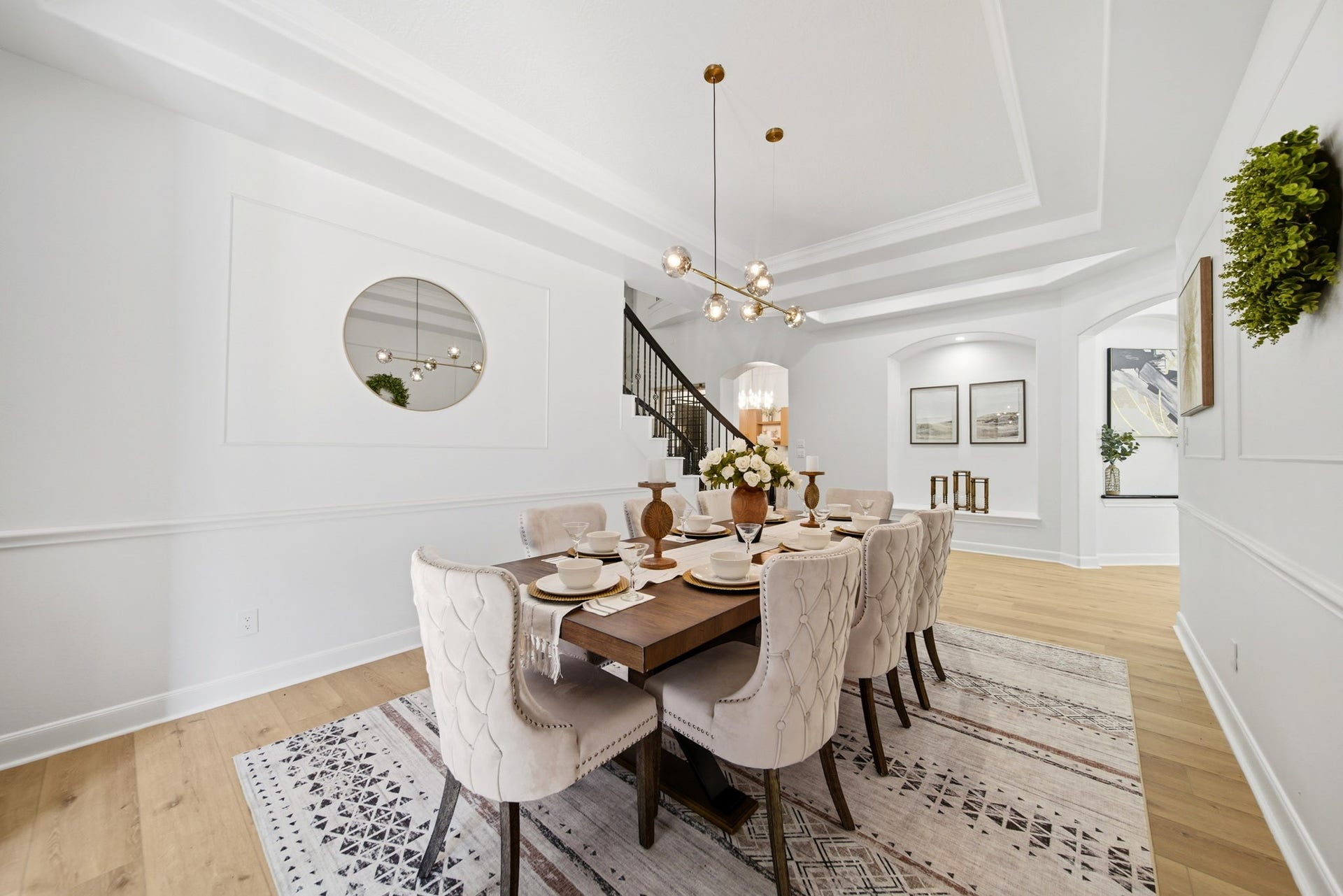 15 Bees Creek Court, Missouri City, TX 77459 Formal dining room with tray ceilings, designer lighting, and sophisticated architectural detailing.