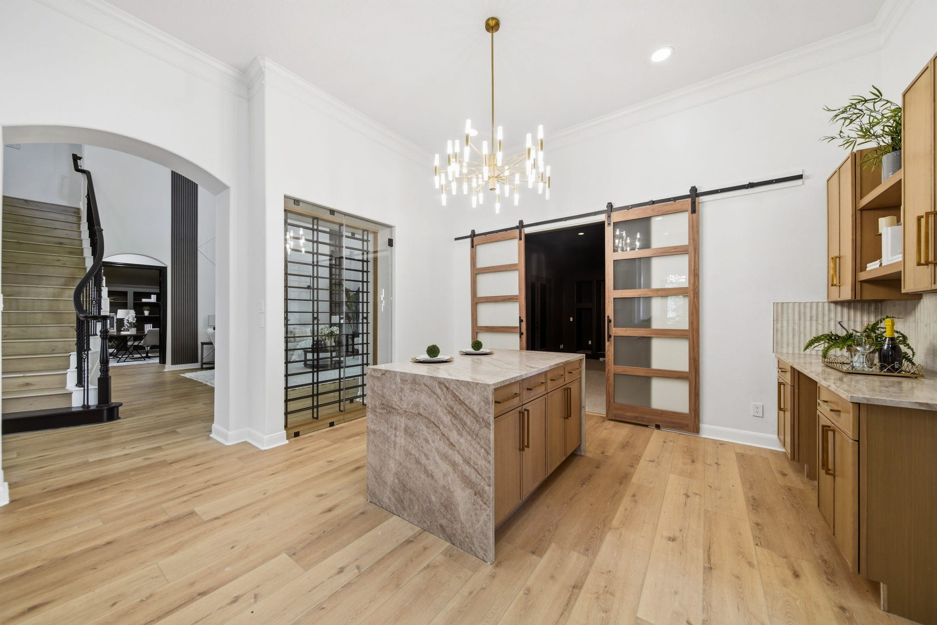 15 Bees Creek Court, Missouri City, TX 77459 Beautiful kitchen with expansive counters, custom details, and seamless flow into living areas.