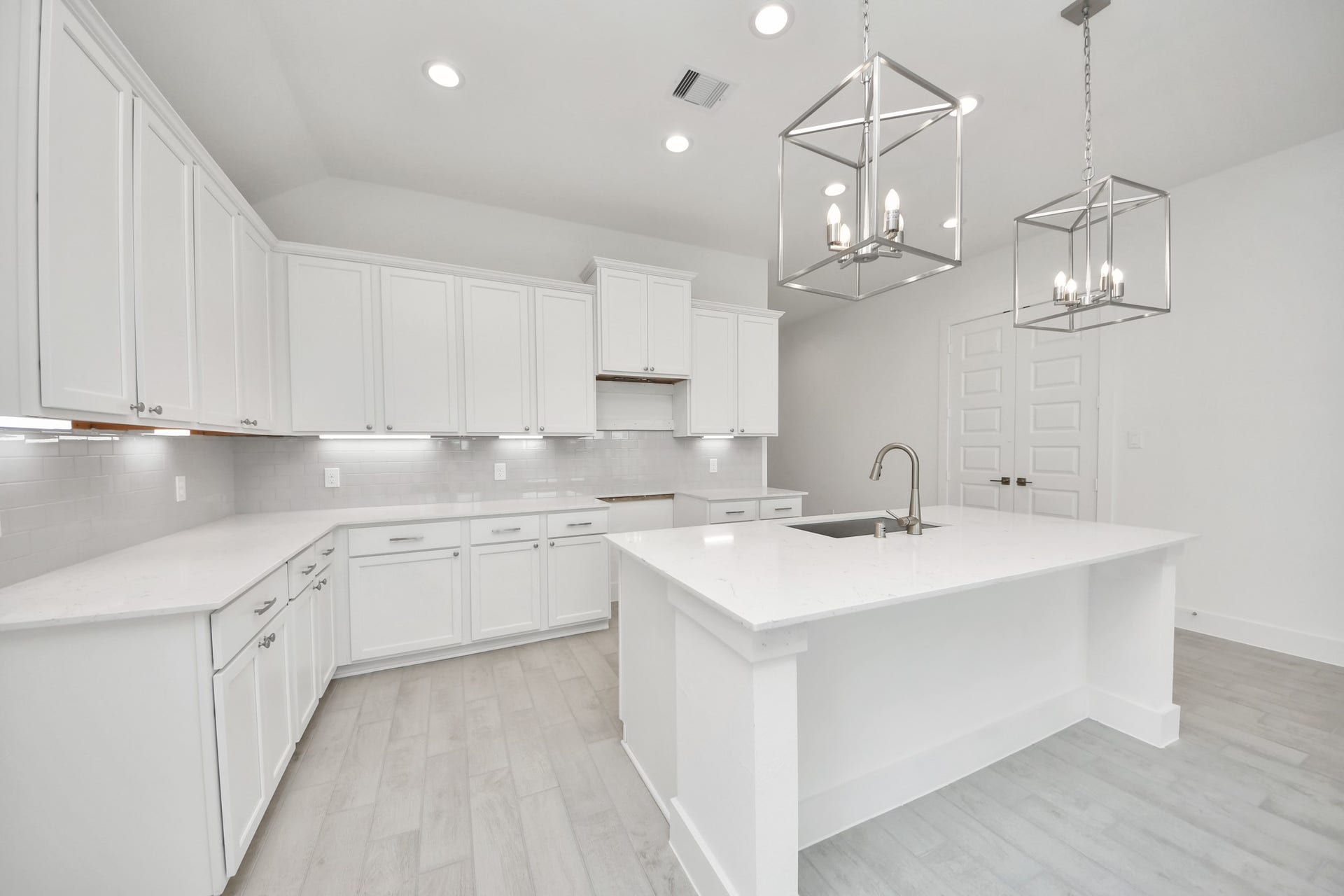 24747 Skerne Woods Drive, Spring, TX 77373 This kitchen is by far any chefs dream! This spacious kitchen features high ceilings, light stained wood cabinets, granite countertop, SS appliances, modern tile backsplash, recessed lighting, extended counter space, granite kitchen island, and space for breakfast bar, and a walk-in pantry all overlooking your huge family room. Sample photo of completed home with similar floor plan. Actual colors and selections may vary.