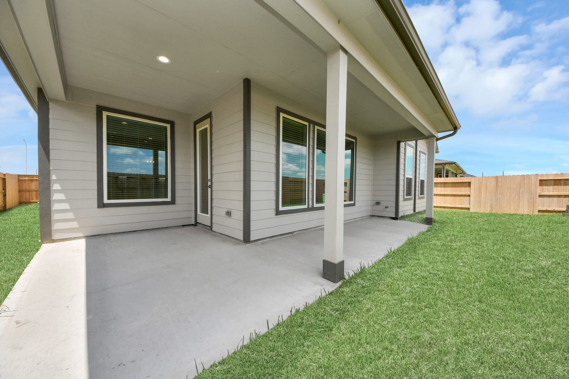 24747 Skerne Woods Drive, Spring, TX 77373 Experience outdoor living at its finest on this expansive covered patio, thoughtfully designed for BBQs and delightful outdoor dining. Sample photo of completed home with similar floor plan. Actual colors and selections may vary.