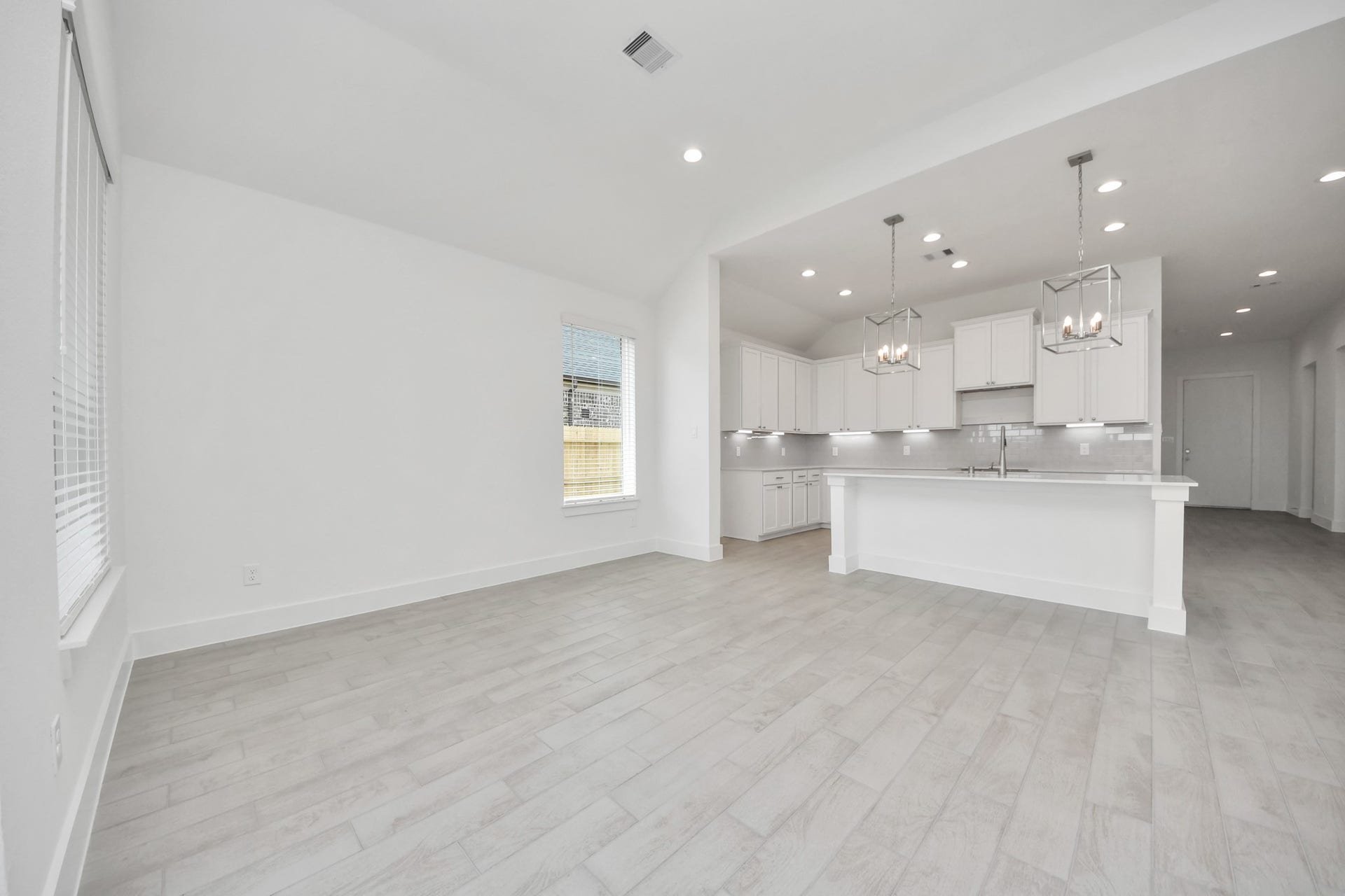 24747 Skerne Woods Drive, Spring, TX 77373 Discover another perspective of this stunning kitchen, generously appointed with an abundance of counter space. Sample photo of completed home with similar floor plan. Actual colors and selections may vary.
