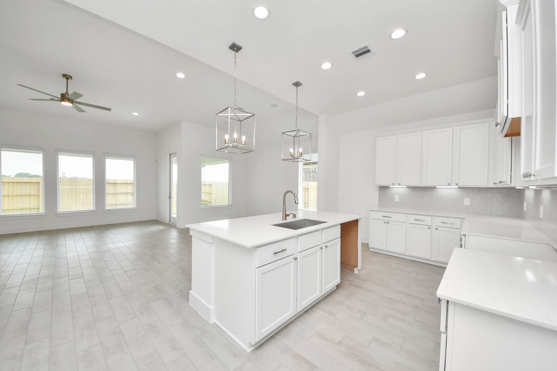 24747 Skerne Woods Drive, Spring, TX 77373 The kitchen is a culinary haven, featuring granite countertops, a tile backsplash, stainless steel appliances, 42 upper cabinets, and undercabinet lighting. Sample photo of completed home with similar floor plan. Actual colors and selections may vary.