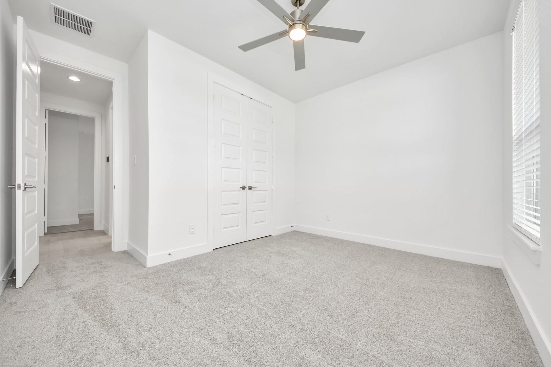 24747 Skerne Woods Drive, Spring, TX 77373 Generously sized secondary bedrooms featuring spacious closets, soft and inviting carpeting underfoot, large windows allowing plenty of natural light, and the added touch of privacy blinds for your personal retreat. Sample photo of completed home with similar floor plan. Actual colors and selections may vary.
