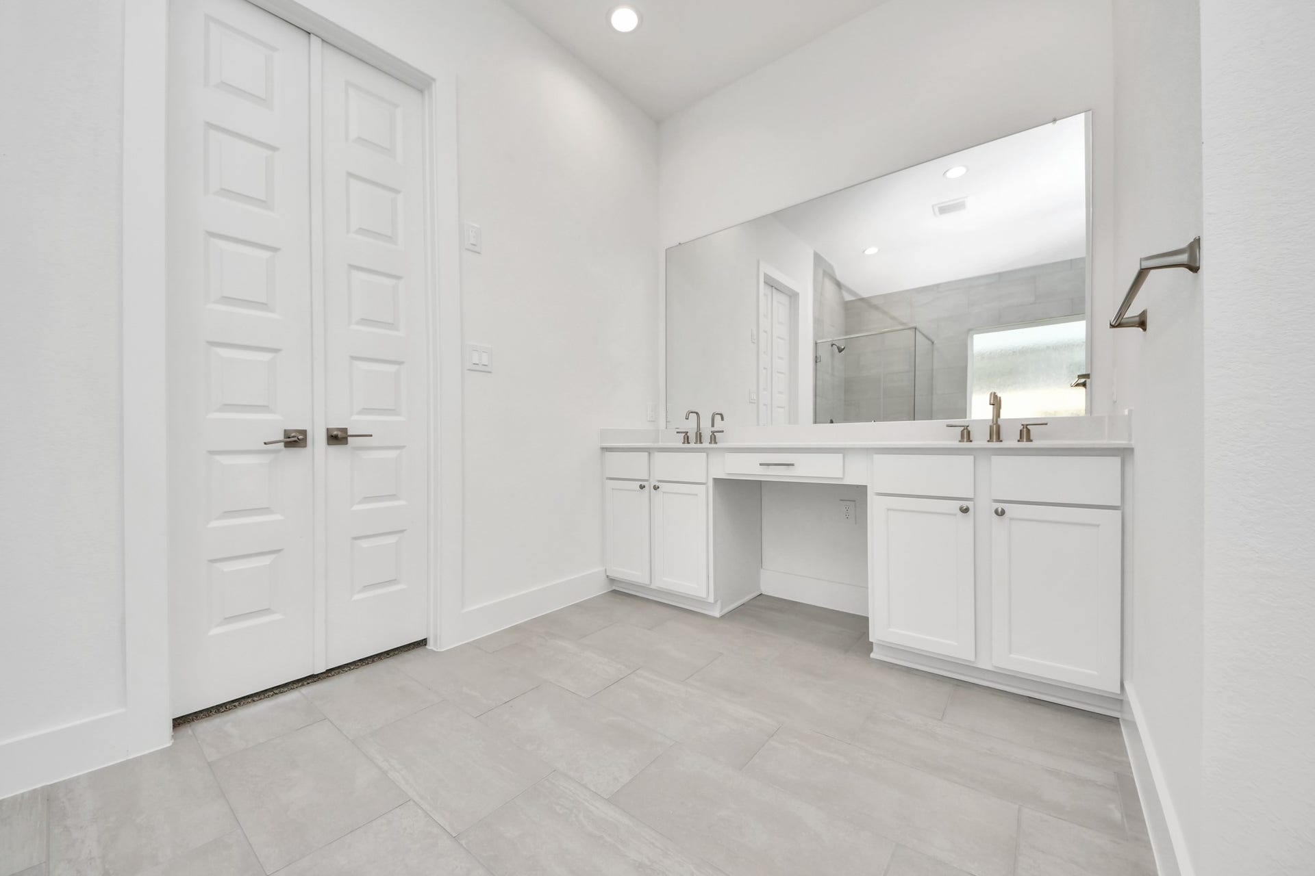 24747 Skerne Woods Drive, Spring, TX 77373 Indulge in a spa-like retreat within the confines of this primary bathroom. Delight in a spacious walk-in shower enveloped in stylish tile surround, unwind in a separate garden tub adorned with custom detailing. Sample photo of completed home with similar floor plan. Actual colors and selections may vary.