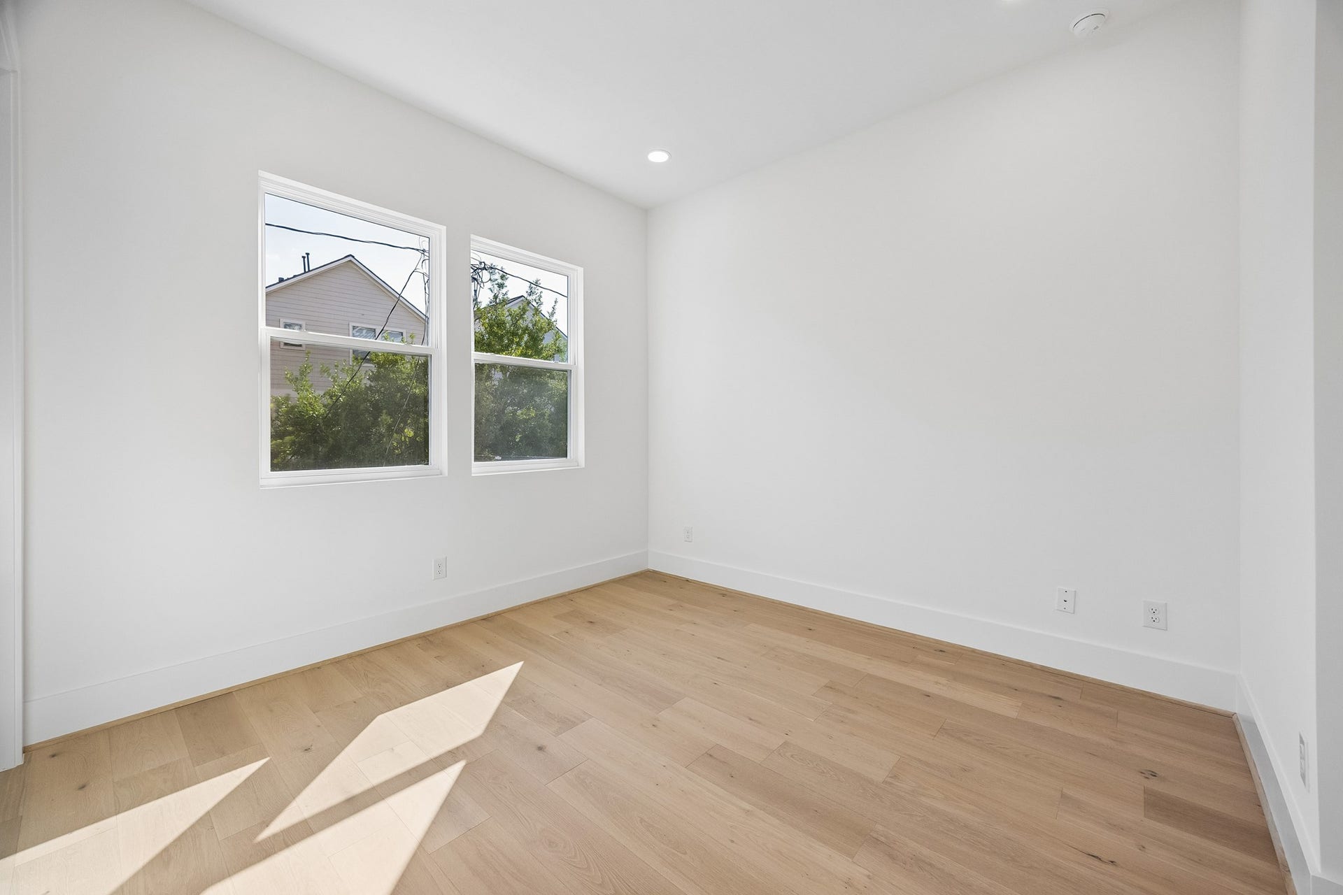 4305 Floyd Street, #B, Houston, TX 77007 Bedroom #2 features wood flooring, recessed lighting and dual windows.