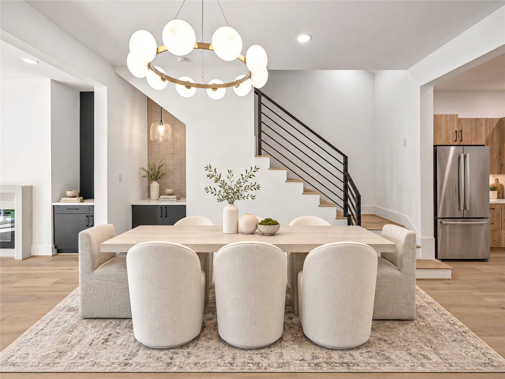 4305 Floyd Street, #B, Houston, TX 77007 Dining area features a sculptural chandelier, a built-in dry bar and seamless flow into the kitchen. (virtual staging)