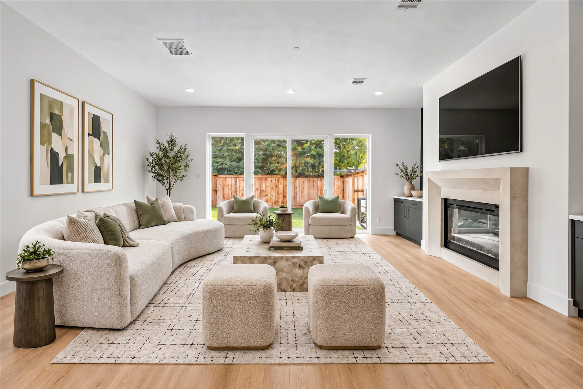 4305 Floyd Street, #B, Houston, TX 77007 Living room features a sleek linear fireplace, built-in cabinetry, a statement accent wall and wood flooring. (virtual staging) Another view of the spacious living room with sliding glass doors overlooking the backyard. (virtual staging)