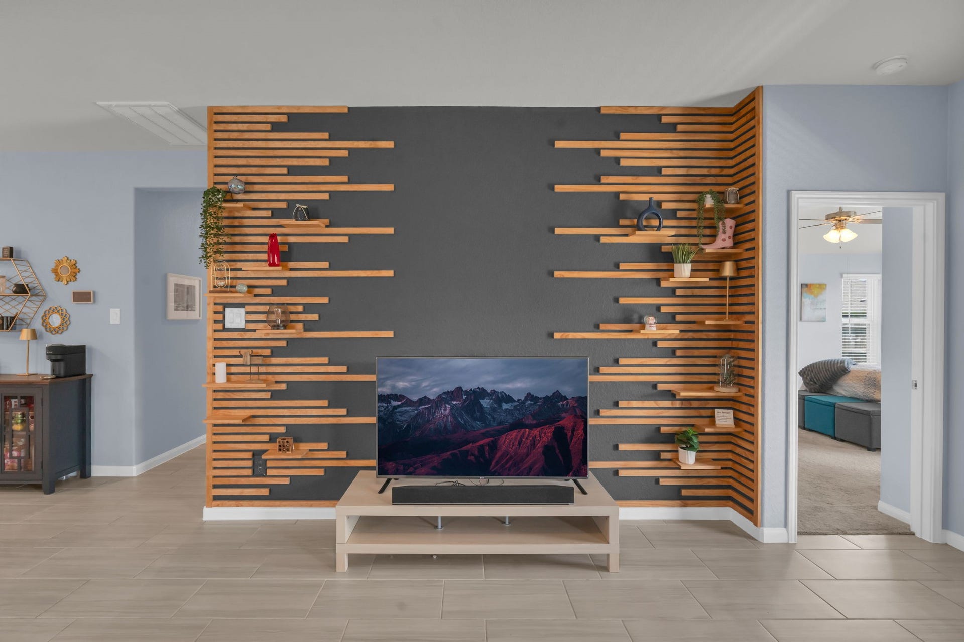 2315 Scarlett Pine Bend, Tomball, TX 77375 Closer look at the striking accent wall featuring built-in adjustable shelving for both style and functionality.