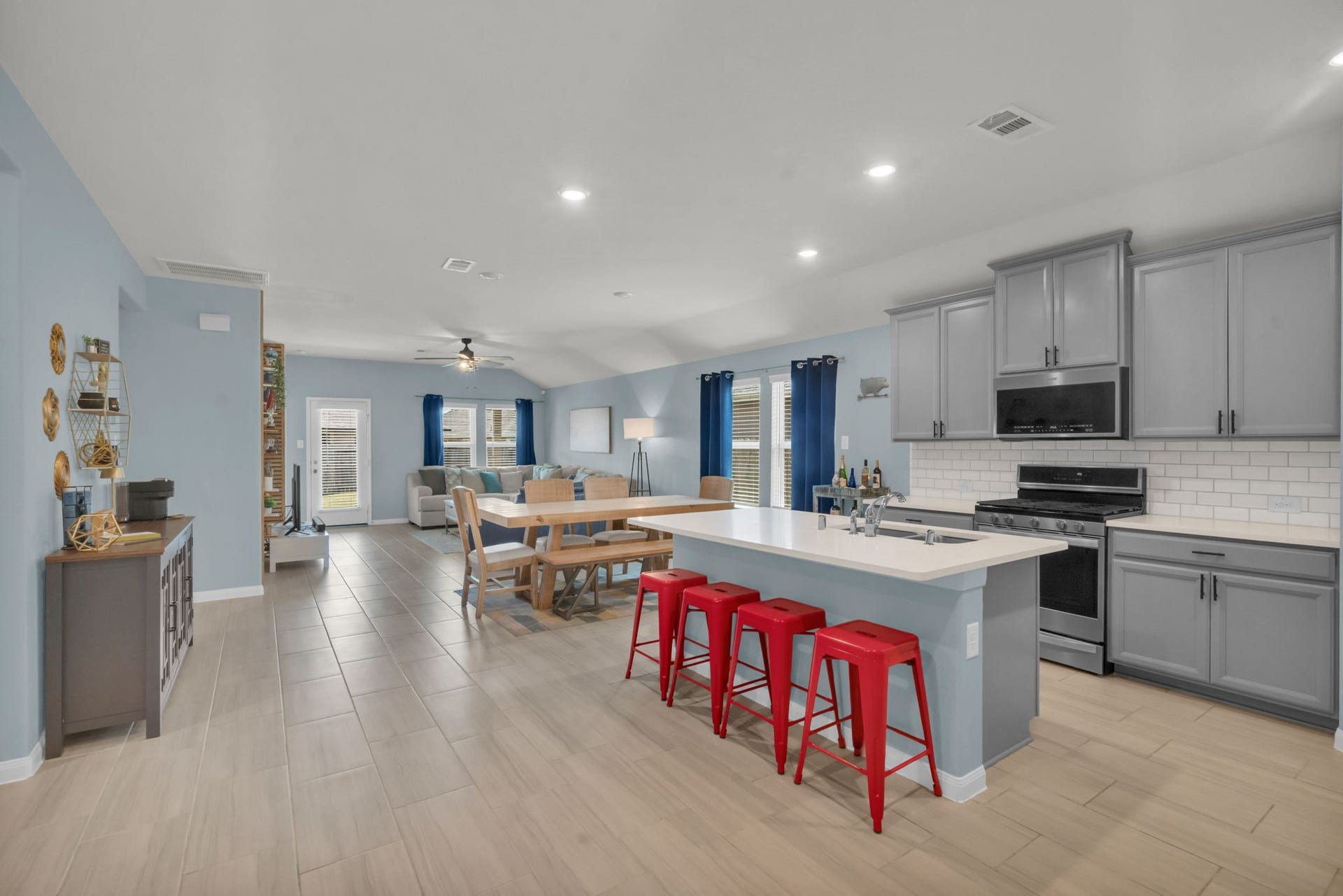 2315 Scarlett Pine Bend, Tomball, TX 77375 This kitchen seamlessly flows into the breakfast nook and living area, creating a welcoming layout perfect for everyday living and entertaining.