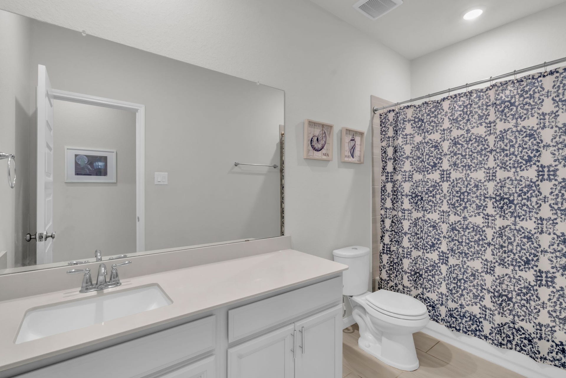 2315 Scarlett Pine Bend, Tomball, TX 77375 Secondary bathroom with lots of storage space and a combination tub and shower.