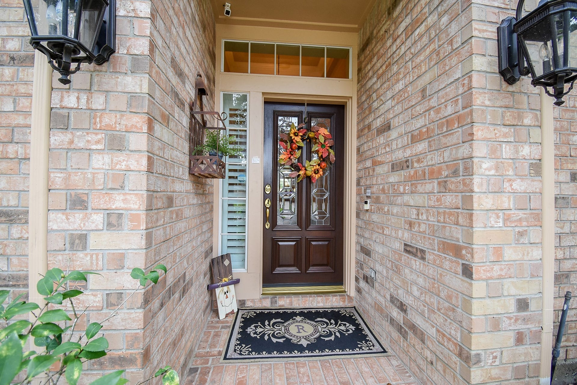 7514 Guinevere Drive, Sugar Land, TX 77479 Covered front porch with lighting and transome windows.