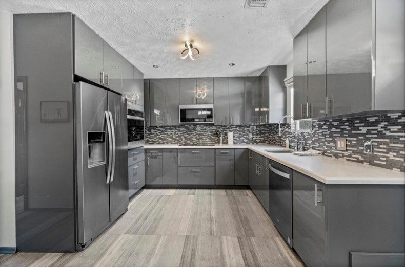 12710 Mutiny Lane, Tomball, TX 77377 The separate guest suite features its own FULL kitchen with a refrigerator, cooking appliances, and ample cabinet storage.