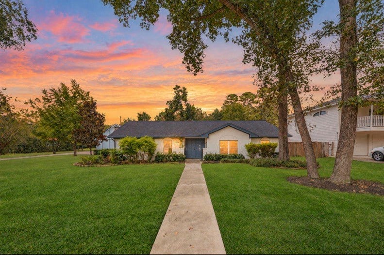 12710 Mutiny Lane, Tomball, TX 77377 Twilight view of the home and its welcoming front entrance.