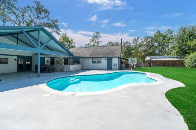 12710 Mutiny Lane, Tomball, TX 77377 Private gunite pool with a spacious surrounding deck and access to the covered patio.
