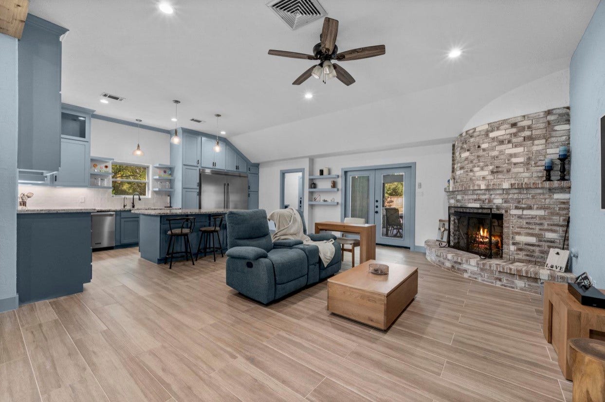 12710 Mutiny Lane, Tomball, TX 77377 An open layout connects the living room, island kitchen, and outdoor access.