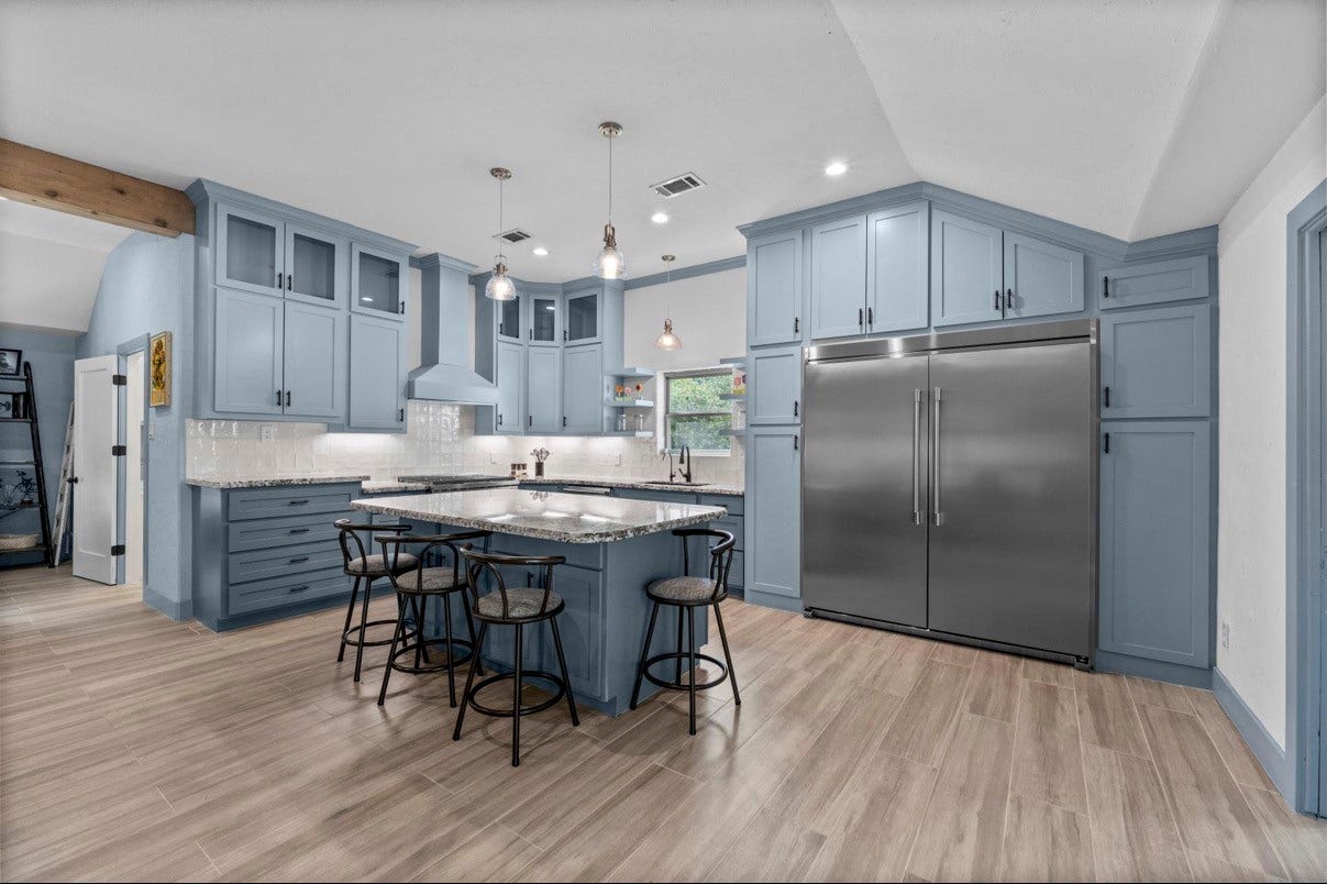12710 Mutiny Lane, Tomball, TX 77377 Large kitchen island offers seating and additional preparation space beneath pendant lights. All Appliances Included!!