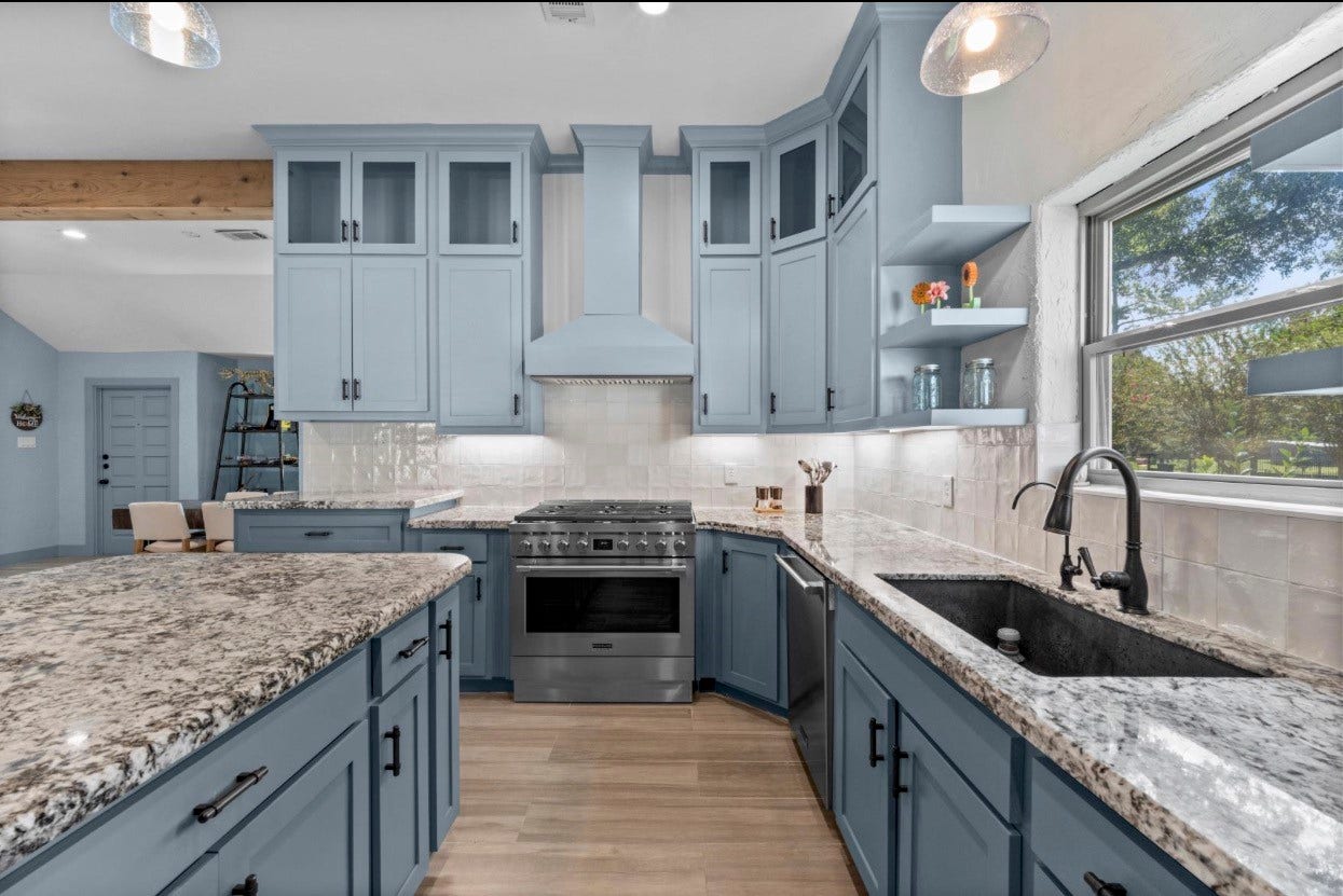 12710 Mutiny Lane, Tomball, TX 77377 Main-house cooking area with a range, generous counter space, and a sink beneath the window.