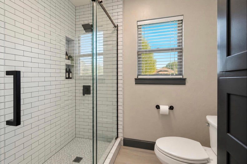 12710 Mutiny Lane, Tomball, TX 77377 Guest-suite shower with a glass enclosure and white subway tile.