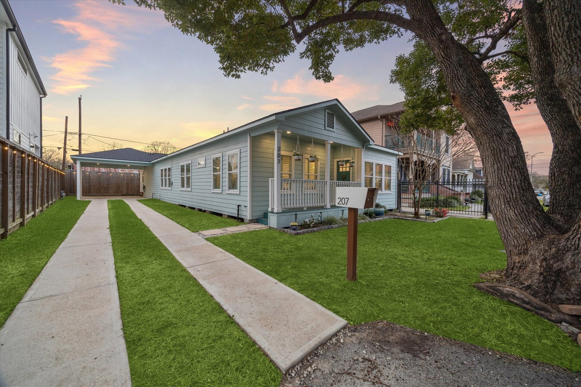 207 Tabor Street, Houston, TX 77009 long drive way, covered parking, EV Charger, crushed white rock paving.