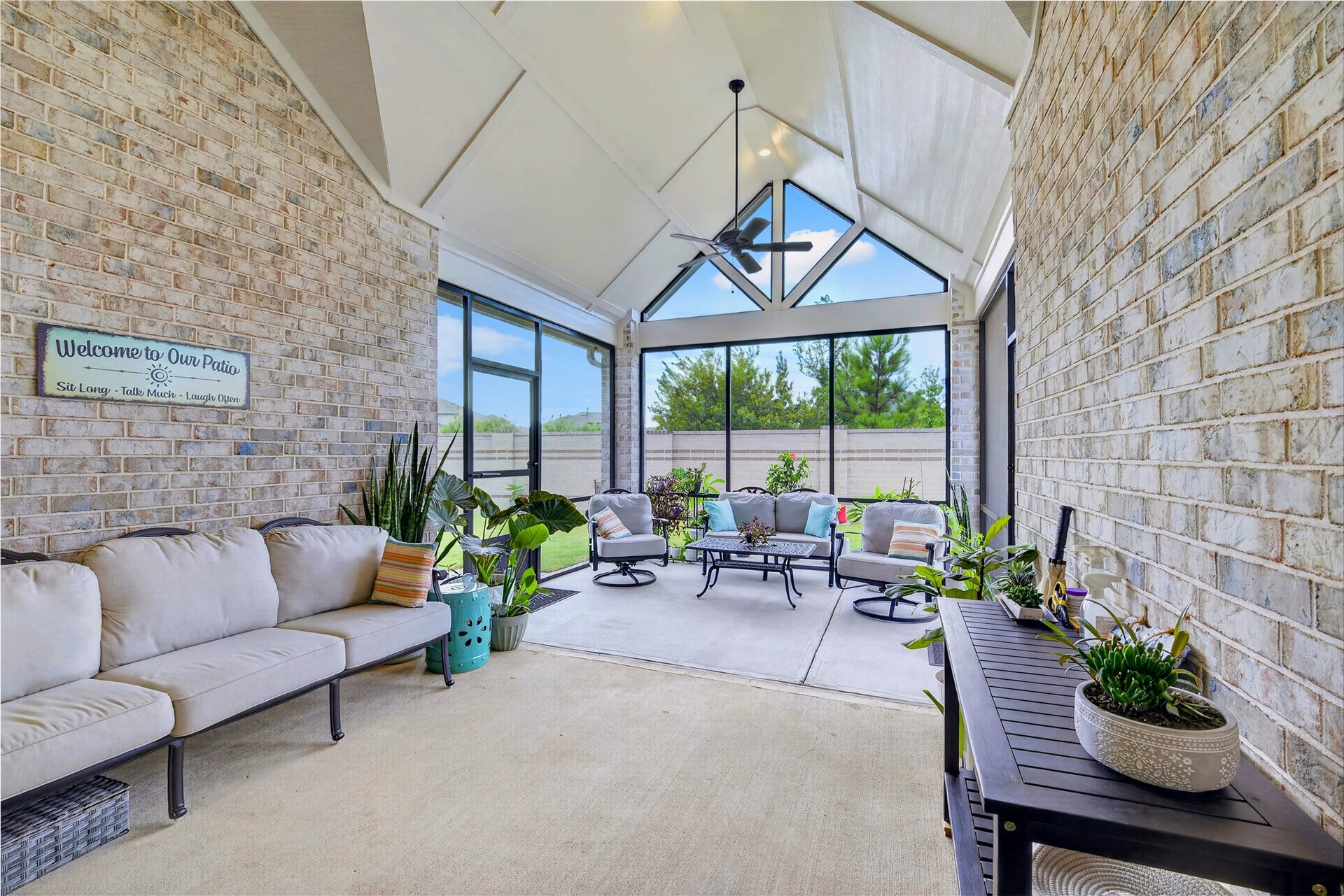 11351 Cosmopolitan Drive, Cypress, TX 77433 Styled and ready to enjoy this screened porch feels like an extension of the home itself. Comfortable furnishing and lush greenery create a warm, inviting space to relax, host friends, or curl up with a good book, all while enjoying the beauty of the outdoors without ever leaving the comfort of shade and screen.