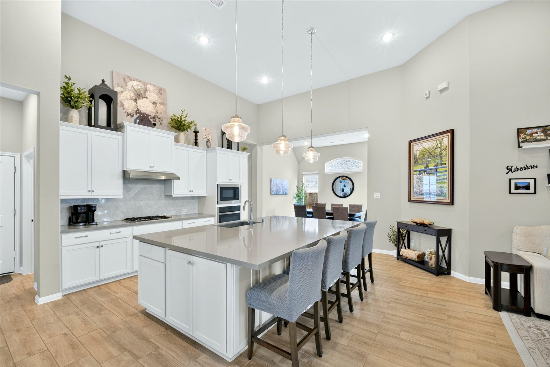11351 Cosmopolitan Drive, Cypress, TX 77433 The large island with seating for four bar stools, easy-maintenance tile flooring, perfect for casual dining or entertaining.