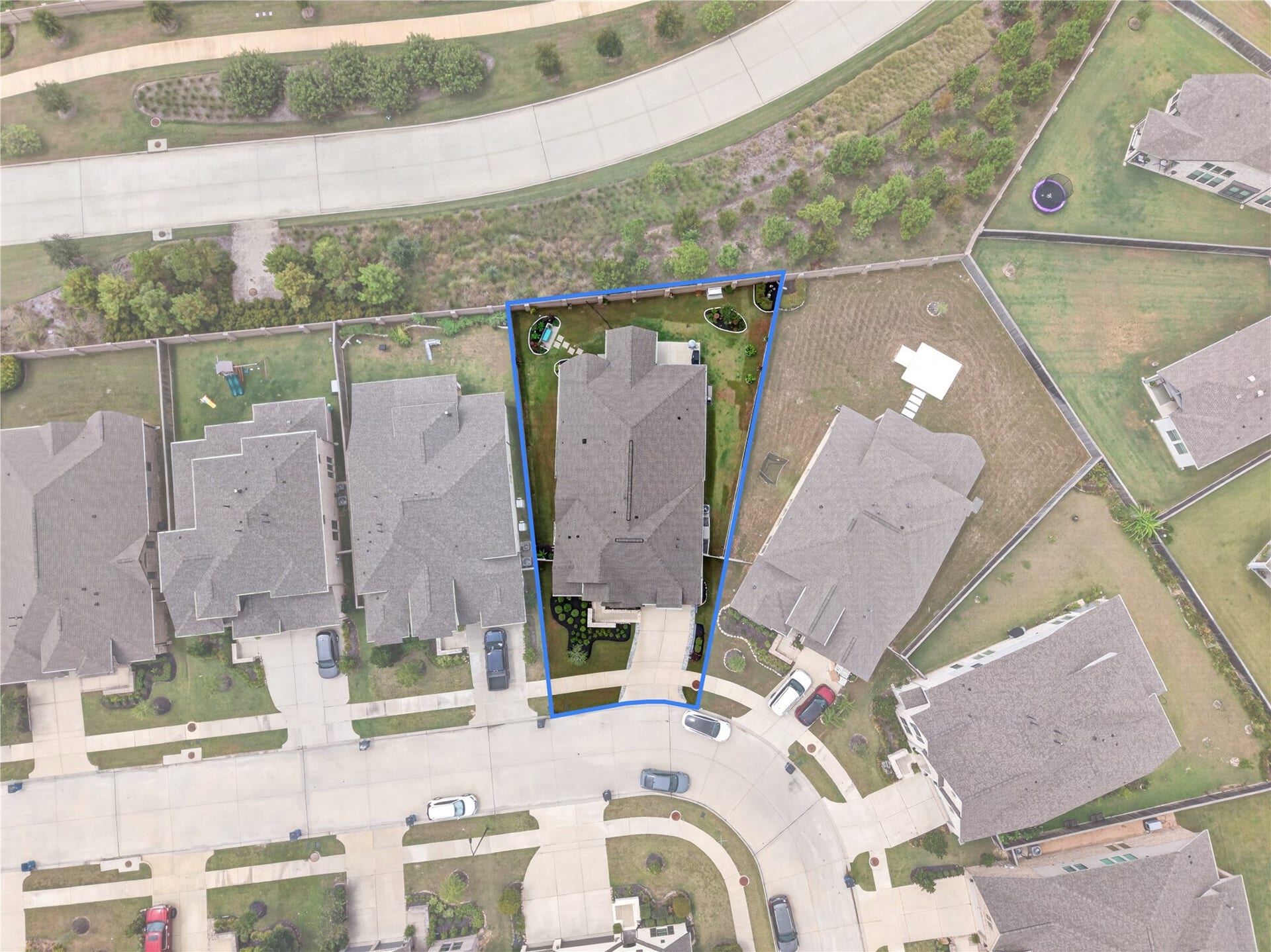 11351 Cosmopolitan Drive, Cypress, TX 77433 Aerial View of this home with a peaceful setting surrounded by greenbelts with no immediate rear neighbors offering added privacy and an open view.