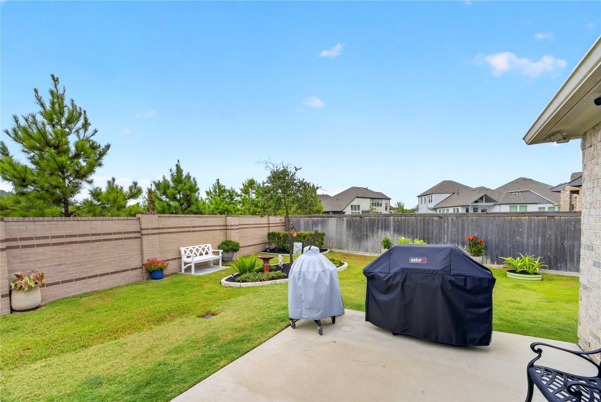 11351 Cosmopolitan Drive, Cypress, TX 77433 Extended deck just off the covered patio, perfect for grilling and outdoor entertaining. Beautifully landscaped gardens create a private and inviting backyard retreat. A must-see home inside and out!