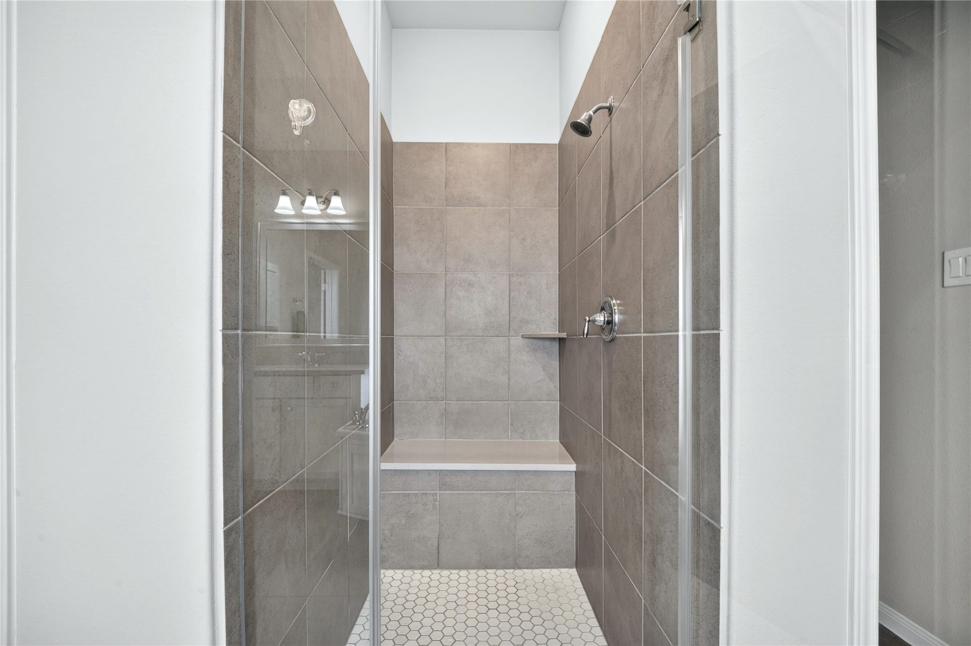 11351 Cosmopolitan Drive, Cypress, TX 77433 Elegant and spacious, the large walk-in shower creates a beautiful focal point in the primary bathroom.