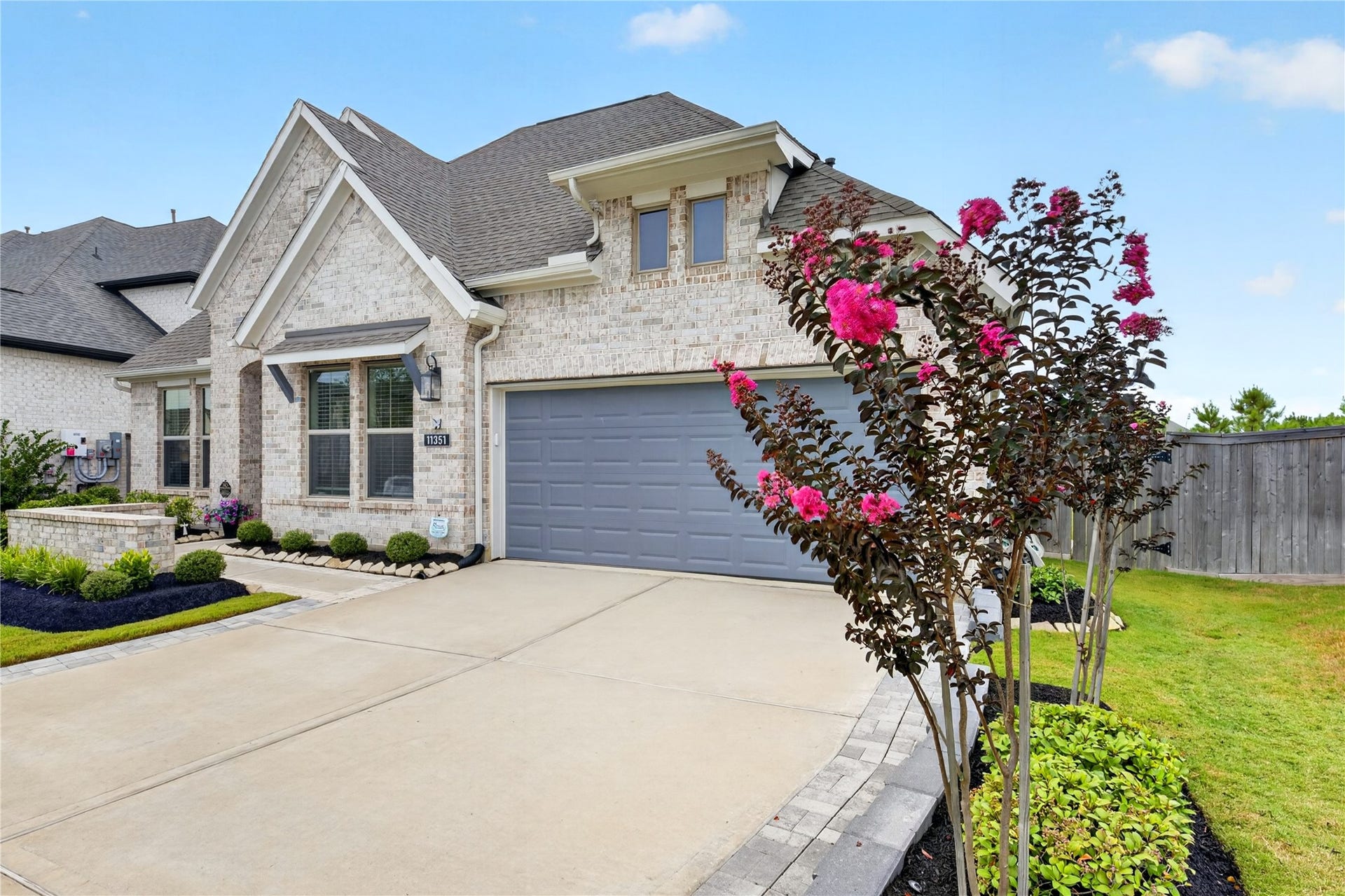 11351 Cosmopolitan Drive, Cypress, TX 77433 Beautifully landscaped grounds and expanded driveway, gutters and a front and back sprinkler system.