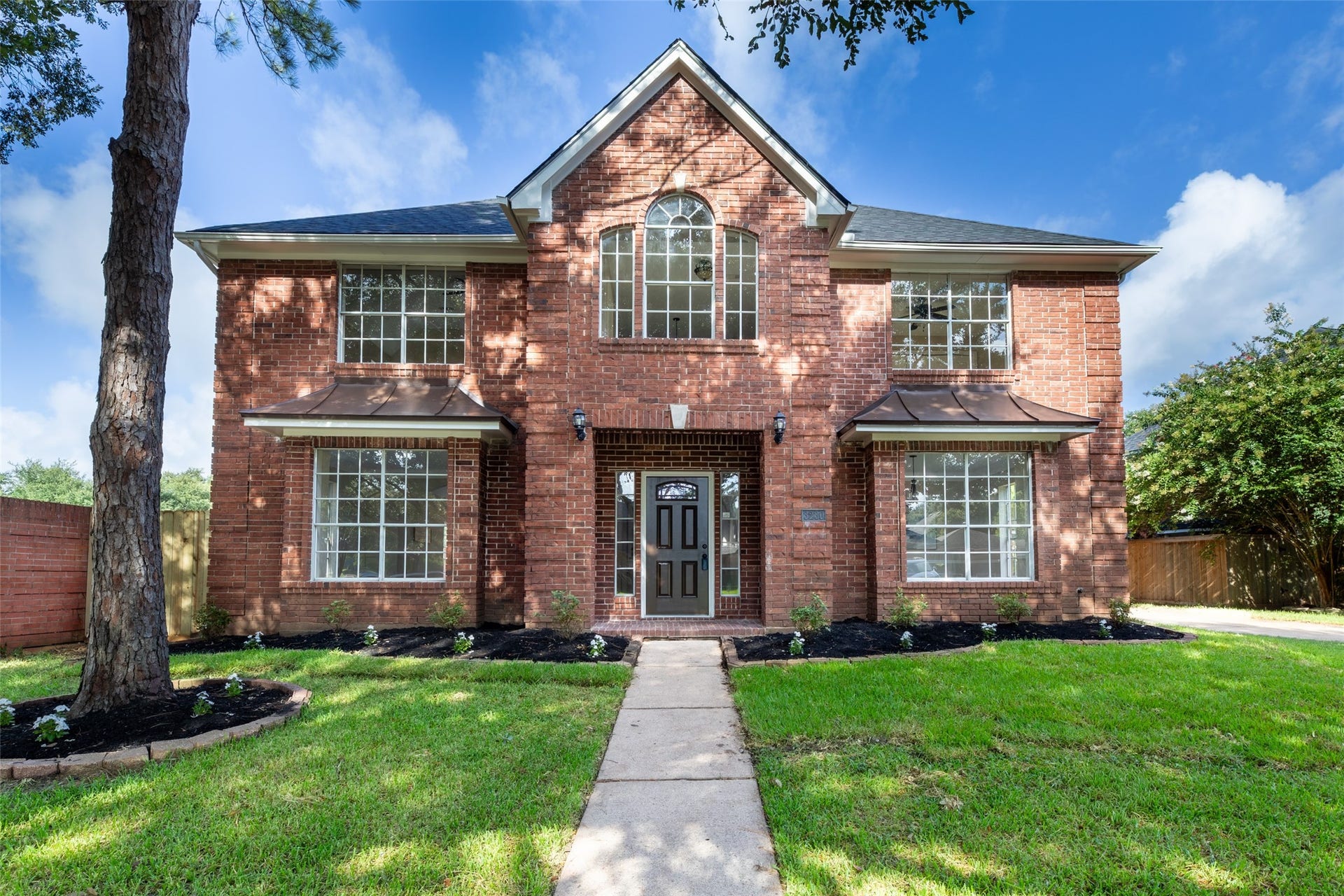 Lovely two-story brick home in the Lakes of Edgewater.