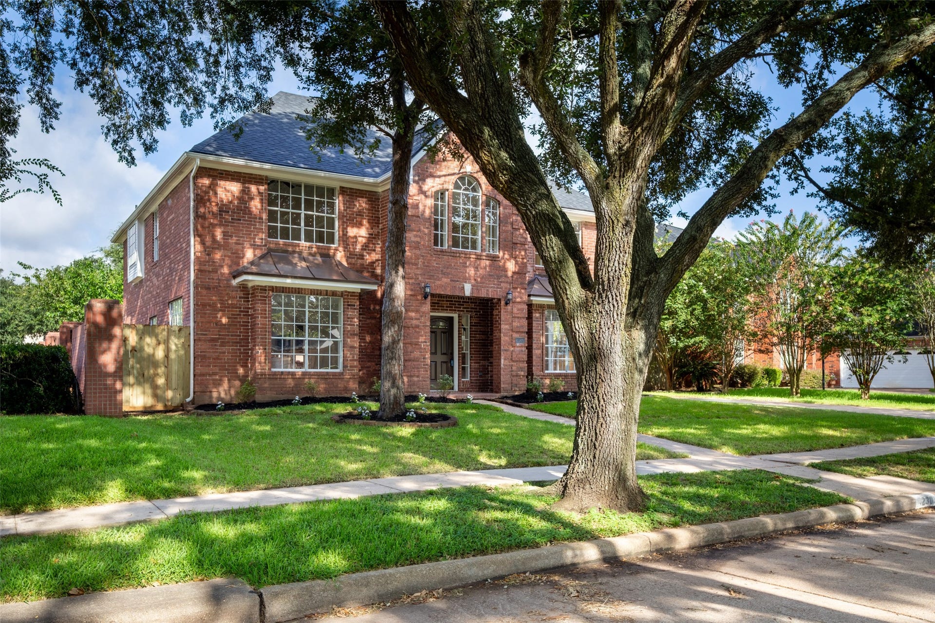 Lush greenery and mature trees, offering a peaceful and inviting setting.