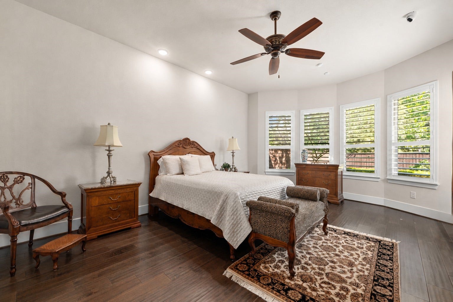 139 Dawning Rays Court, Conroe, TX 77304 Welcome to your beautiful primary suite! This spacious retreat offers gorgeous wood flooring, elegant shutters, abundant natural light, and plenty of room for a comfortable sitting area.