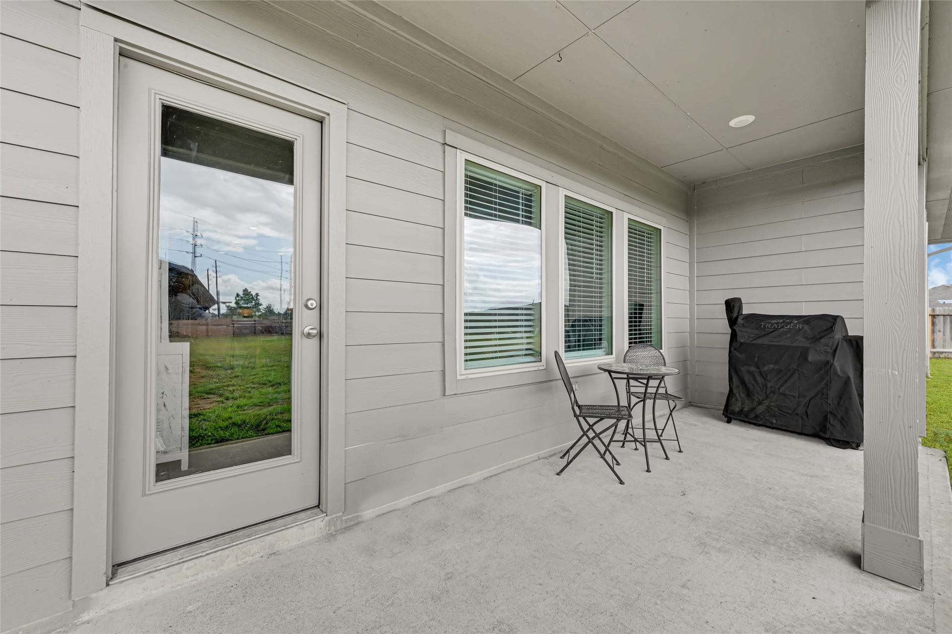 Covered Patio and Brand New living room windows.