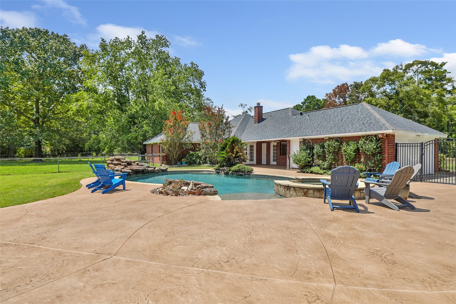 26342 Hill And Dale Avenue, Splendora, TX 77372 Freshly refinished pool decking around the pool and hot tub.