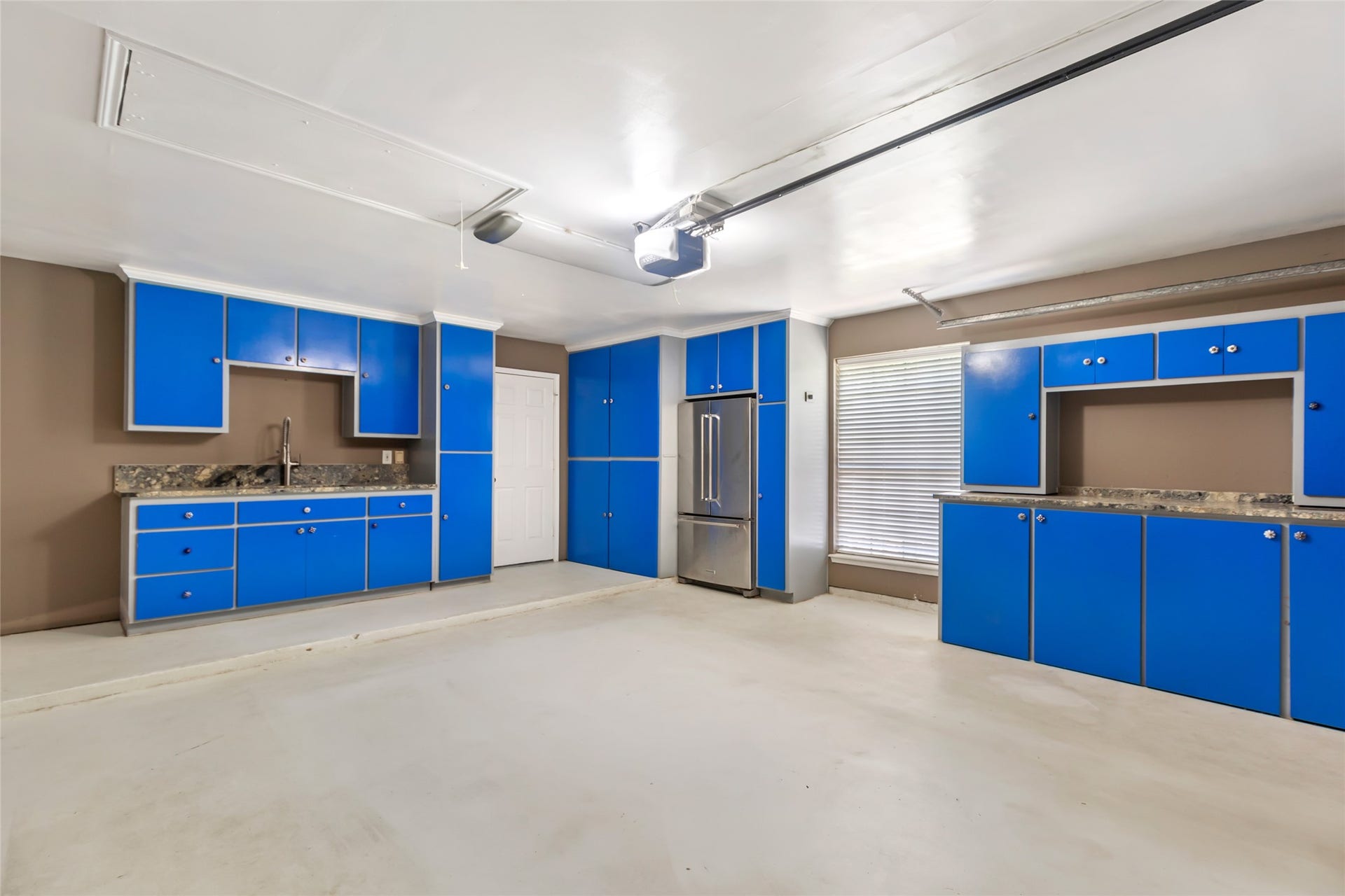 26342 Hill And Dale Avenue, Splendora, TX 77372 Garage attached to home with plenty of built-in storage.