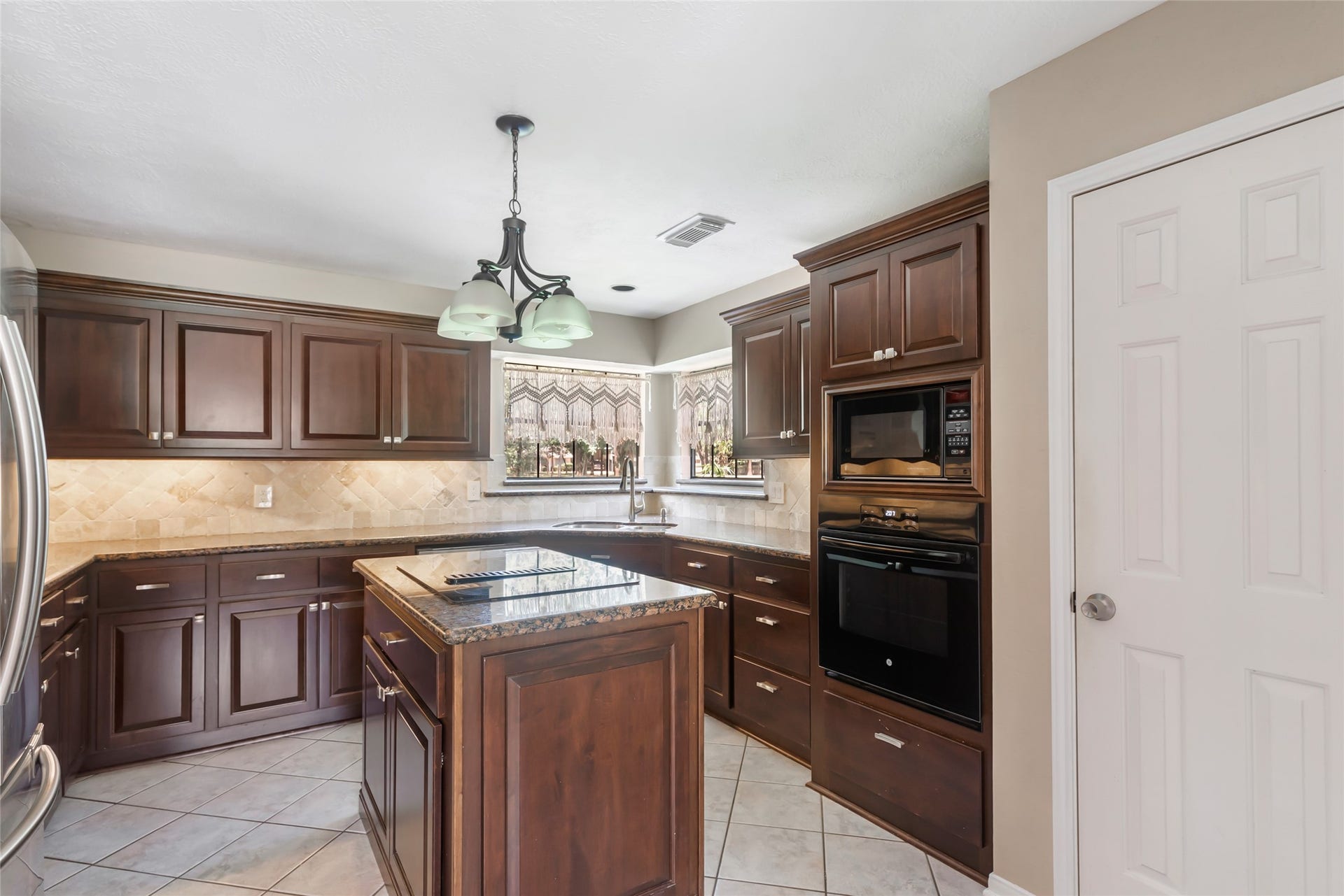 26342 Hill And Dale Avenue, Splendora, TX 77372 Kitchen with a cooktop in the island.